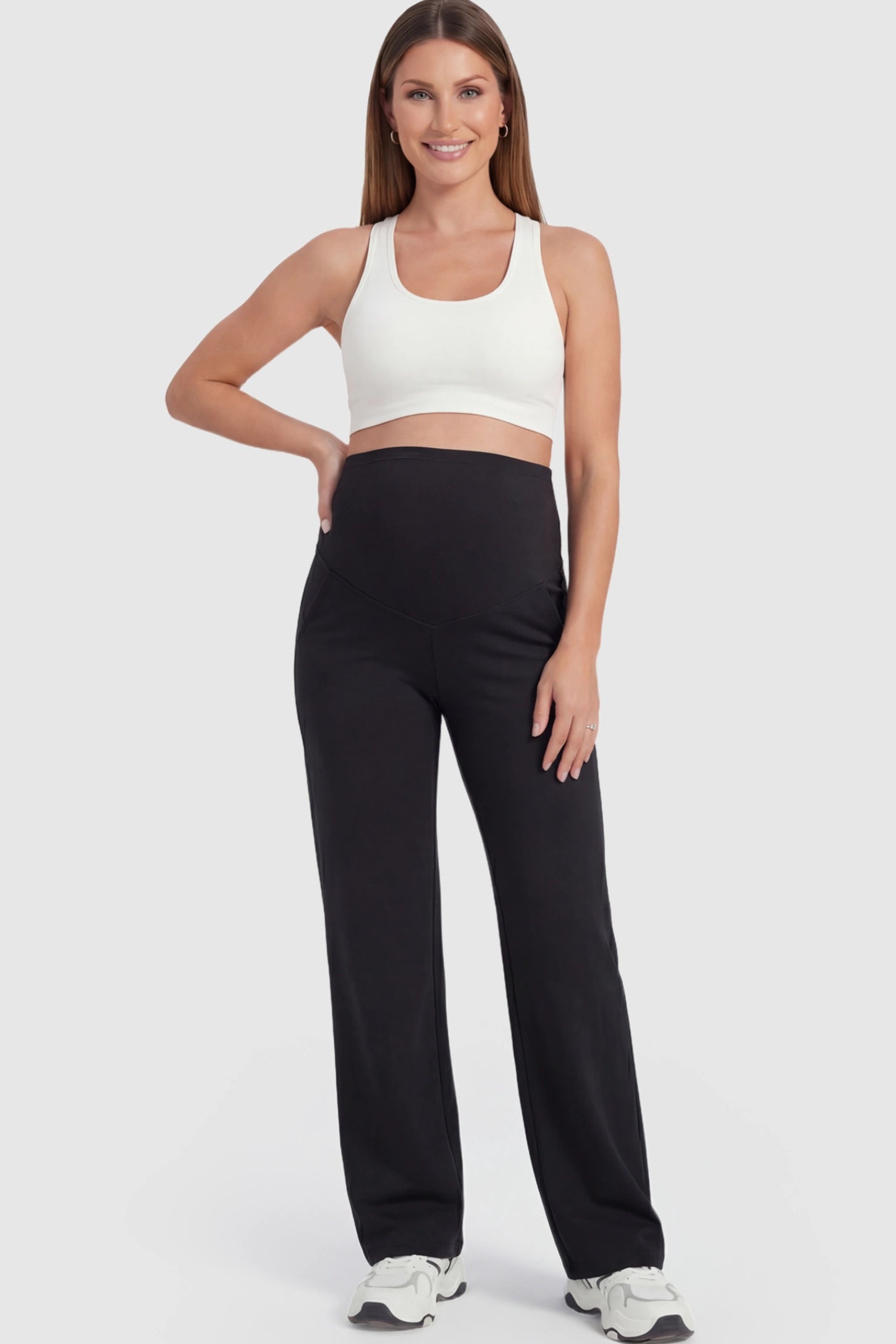 Full Panel High Waist Wide Leg Maternity Pants in Black featuring a supportive expansion-waist on a pregnant model facing front.