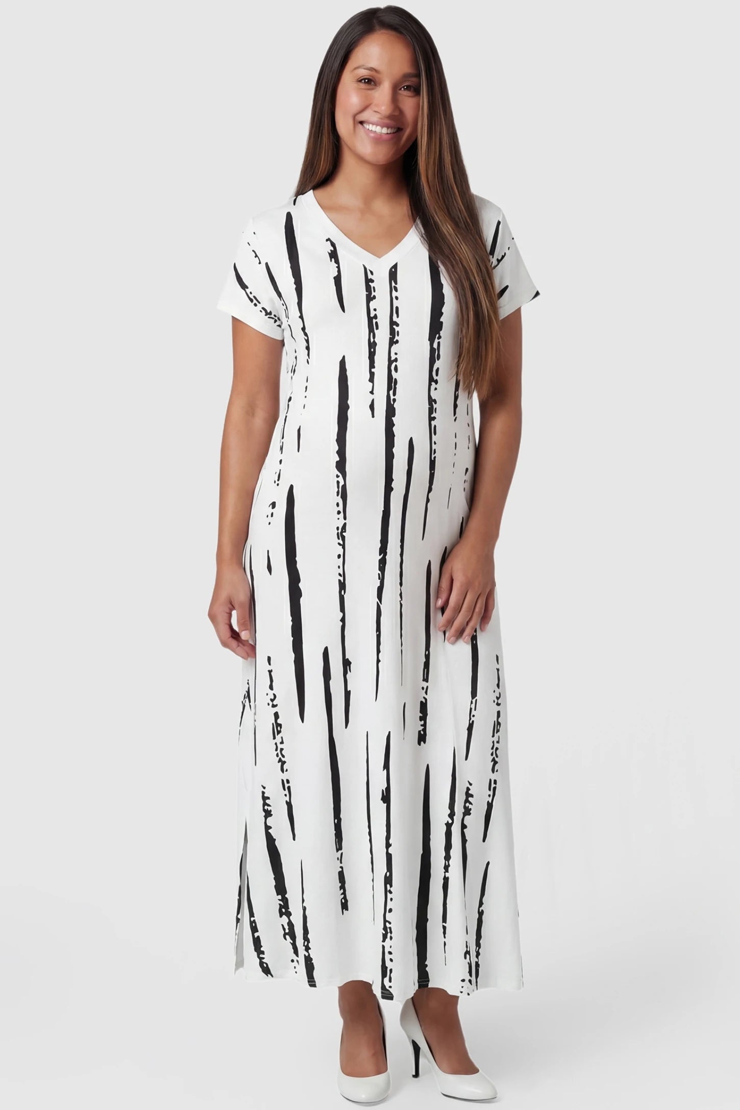 Abstract Stripe V-Neck Maxi Maternity Dress in Black Stripe featuring a side slit on a pregnant model, front view.