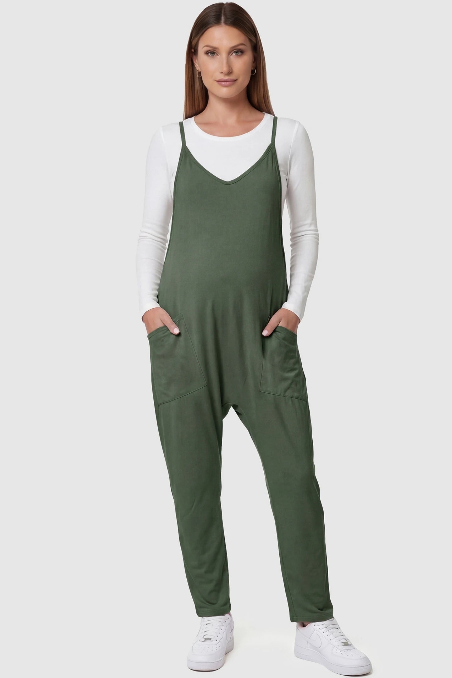 Adjustable Strap Relaxed Maternity Jumpsuit in Army Green featuring a loose fit and functional pockets on a pregnant model.