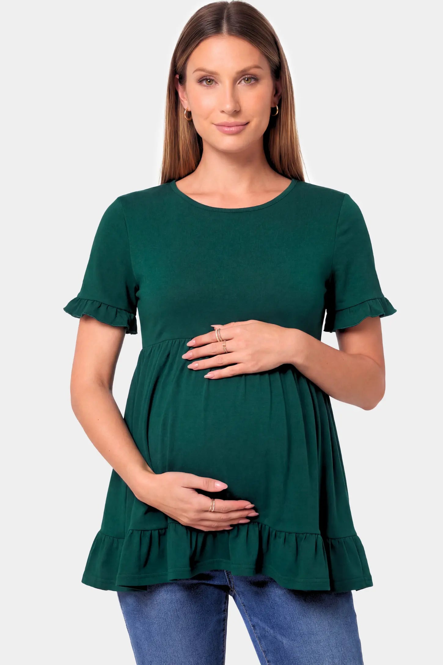 Crew Neck Babydoll Maternity Top in dark green featuring an empire waist and flutter sleeves on a pregnant model.
