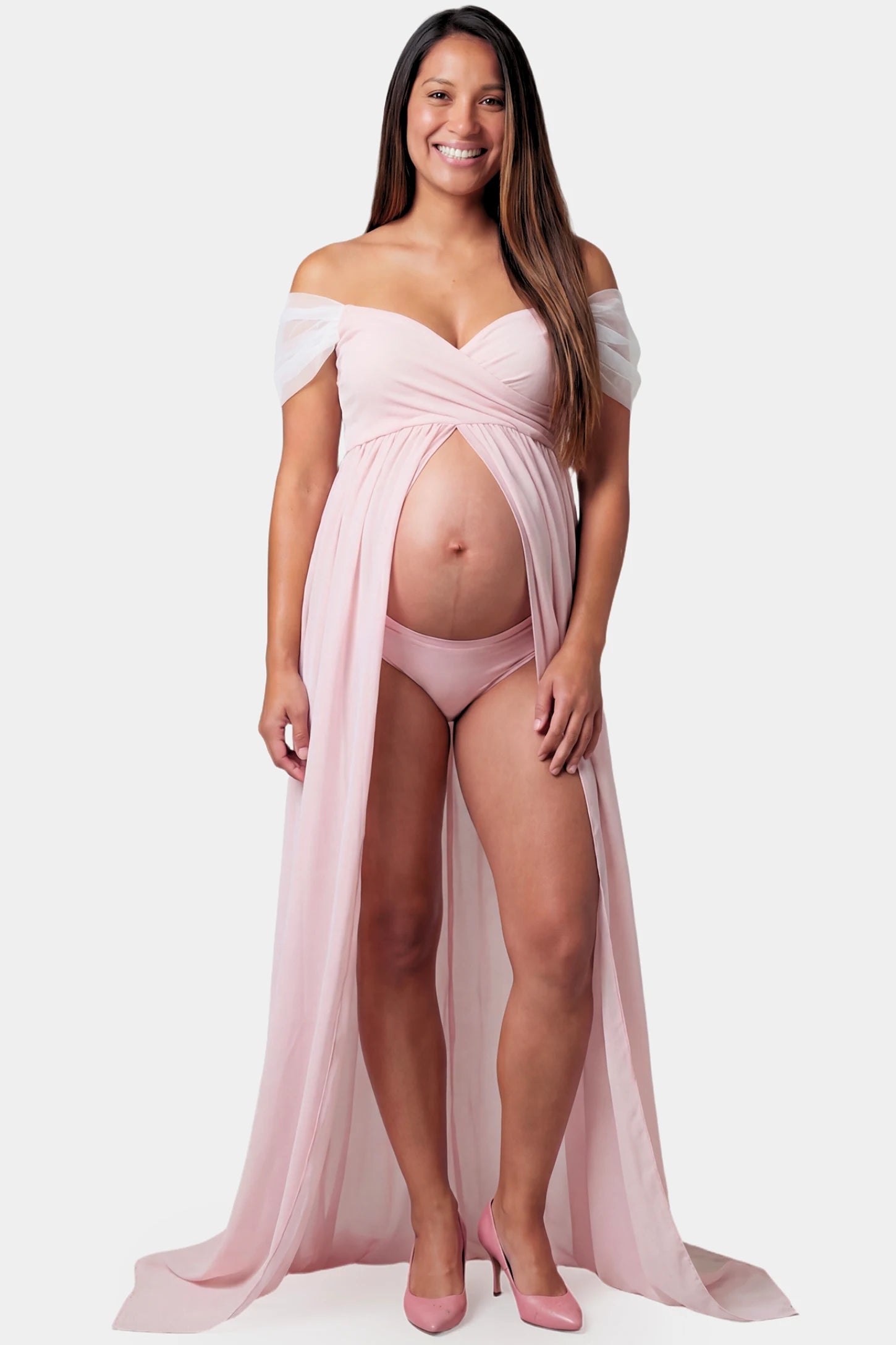 Cap Sleeve Empire Waist Maternity Photoshoot Gown in pink featuring sweetheart neckline and flowy skirt on pregnant model.