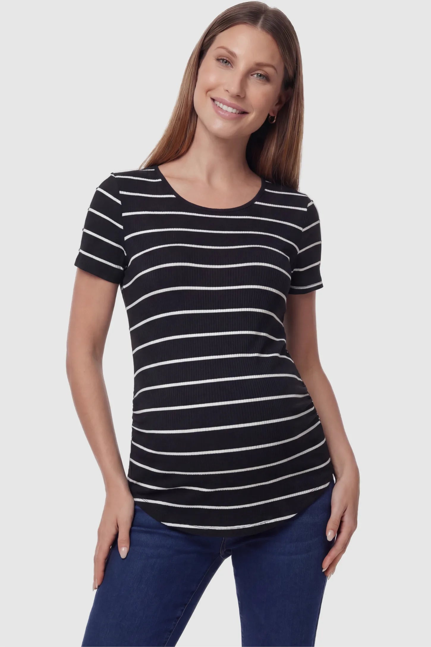 Striped crew neck short sleeve maternity top in black and white shown in front view on a pregnant model