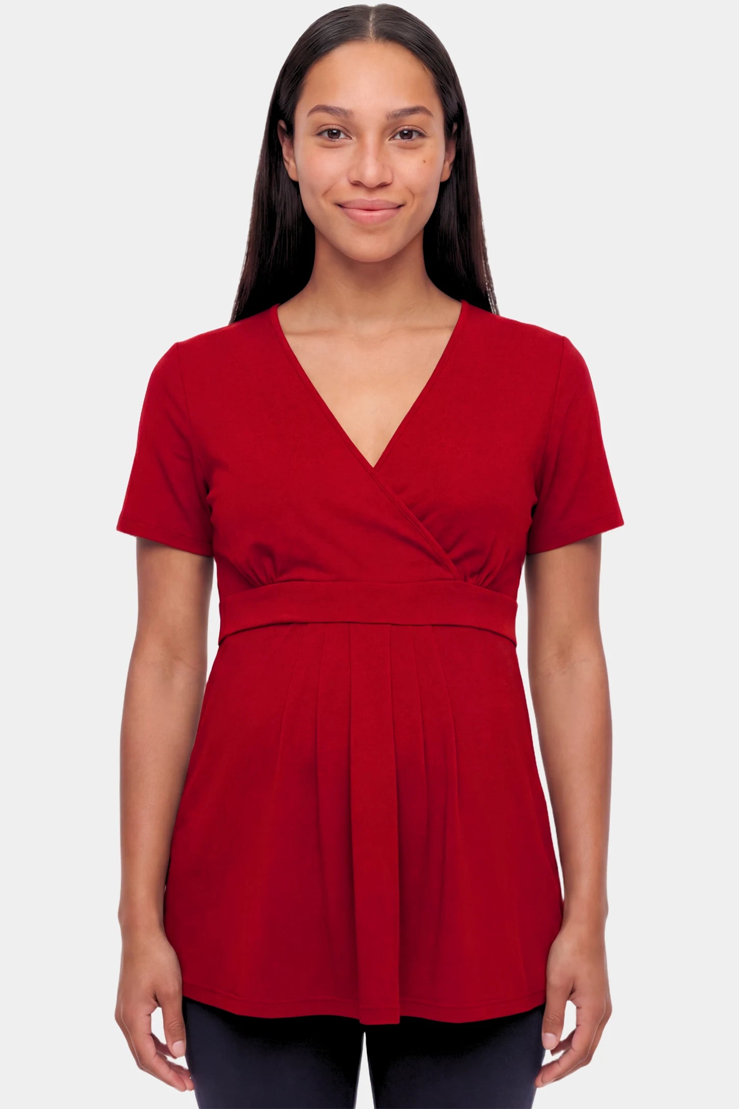 Crossover Short Sleeve Maternity & Nursing Top in burgundy featuring a crossover V-neck and empire waist on a pregnant model.
