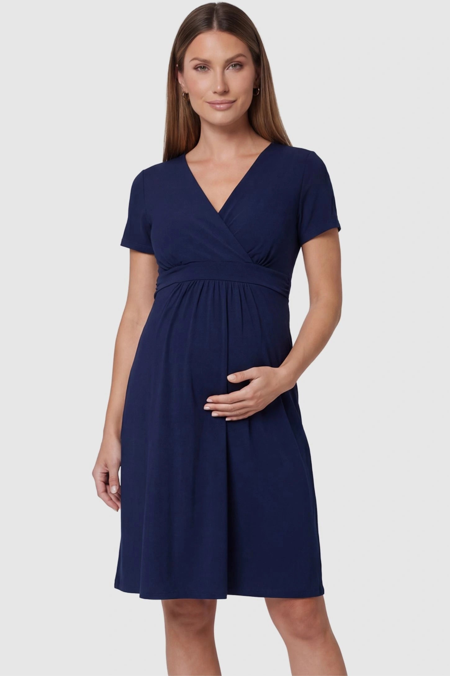 V-Neck Empire Waist Short Maternity and Nursing Dress in navy blue featuring A-line silhouette in full body front view on a pregnant model