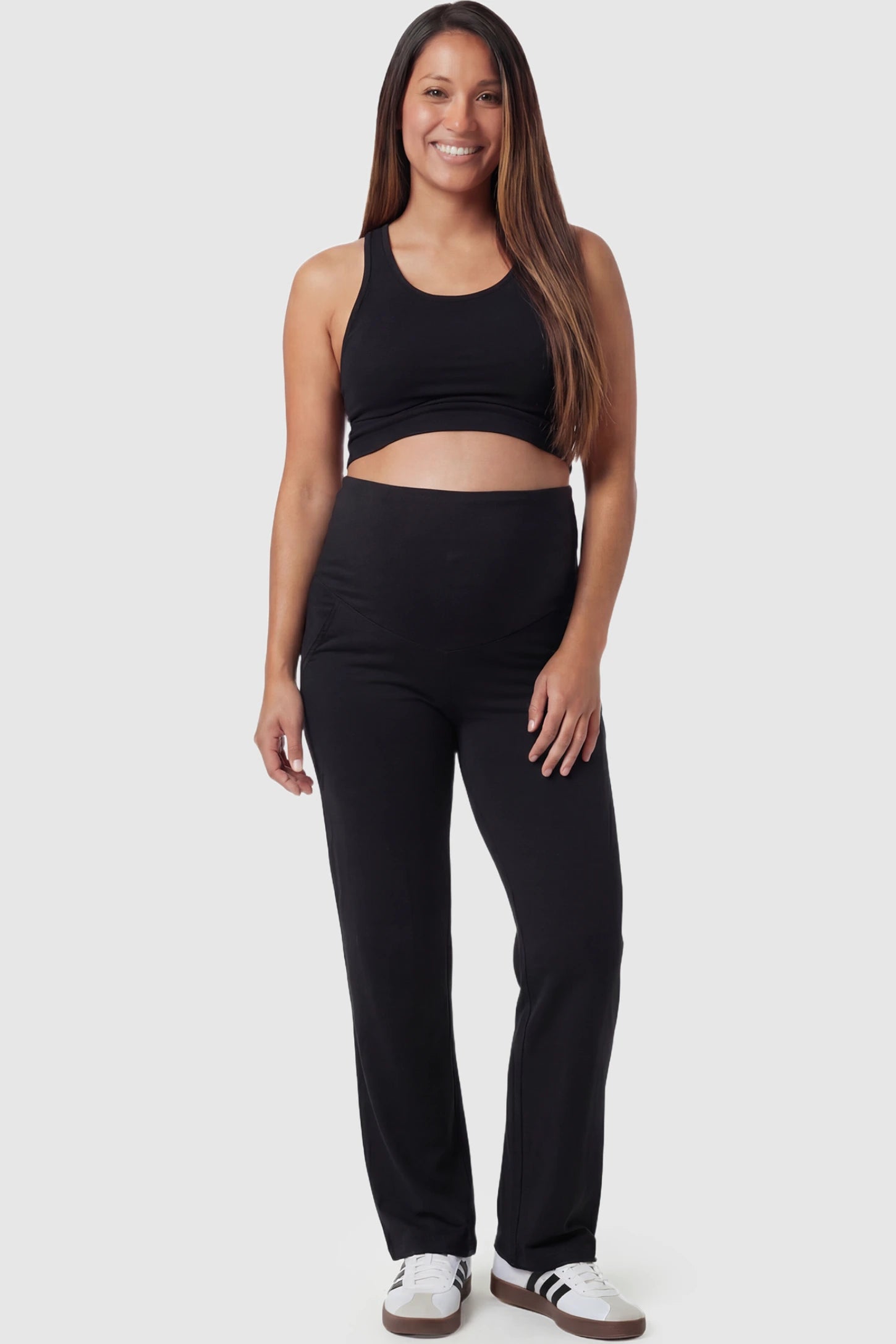 High Waist Full Panel Flare Leg Maternity Pants in black featuring over-the-belly high stretch fit on pregnant model.