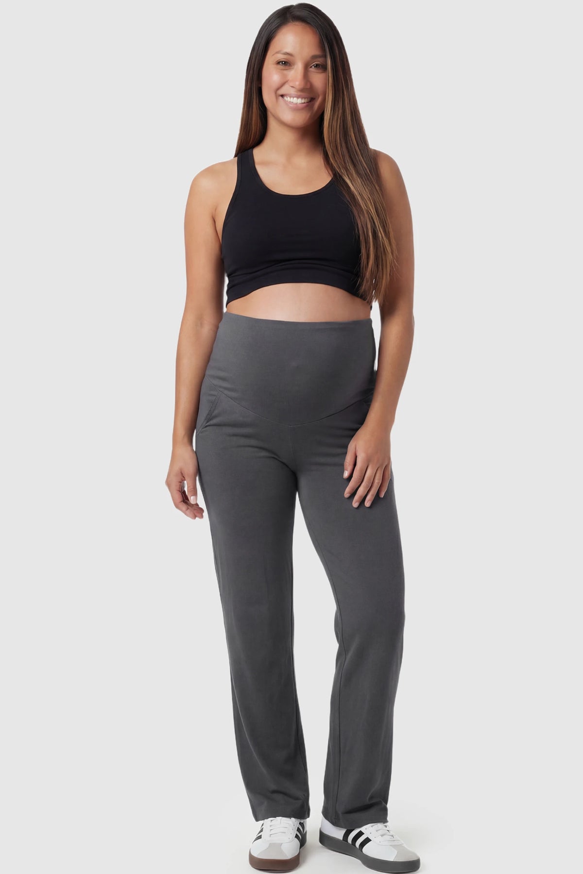 High Waist Full Panel Flare Leg Maternity Pants in gray featuring over-the-belly high stretch fit on pregnant model showing front.