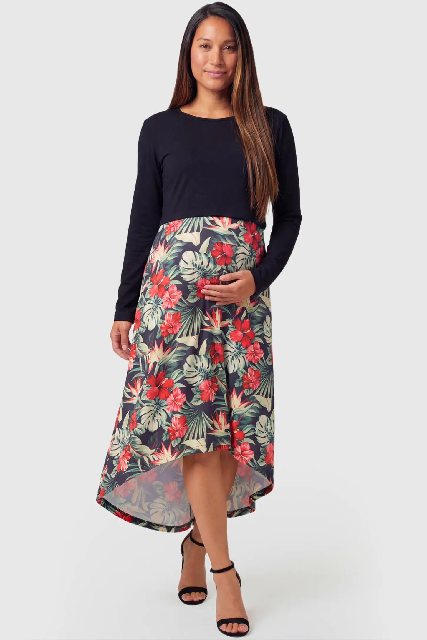 Hi-Low Long Sleeve Maternity & Nursing Midi Dress in black and floral featuring empire waist and round neckline on pregnant model.