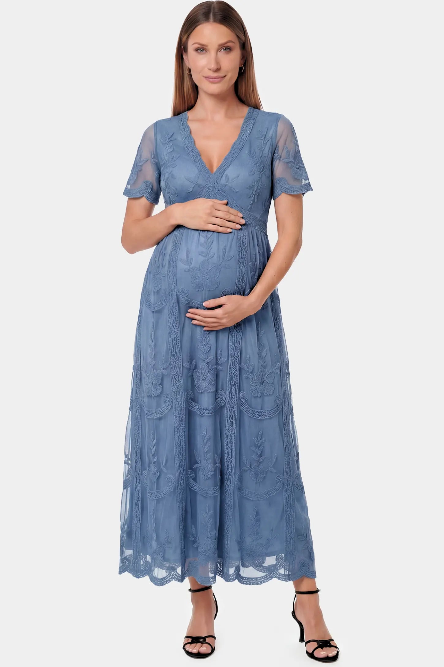 Lace Short Sheer Sleeve Maternity Maxi Dress in blue lace featuring sheer short sleeves and an empire waist silhouette on a pregnant model.