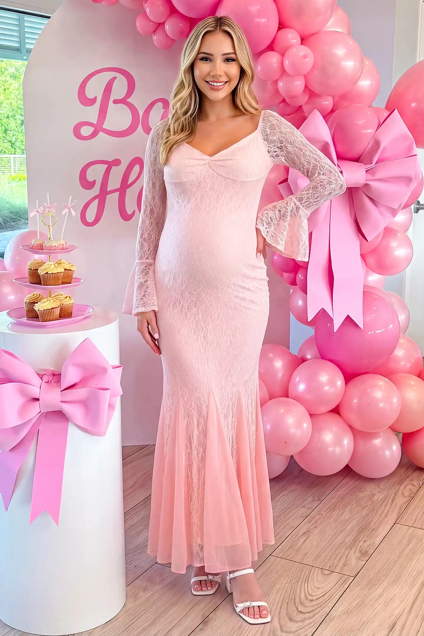 Lace Off Shoulder Mermaid Maternity Gown in pink lace featuring a sweetheart neckline, long sleeves, and a fitted mermaid silhouette on a pregnant woman in indoor setting front view.