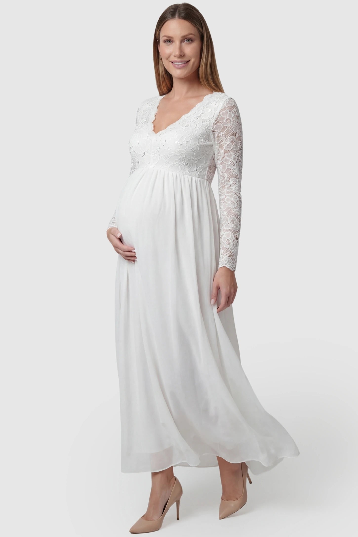 Lace & Chiffon Empire Waist Maternity Wedding Gown in White featuring a V-neck and long sleeves on a pregnant model.