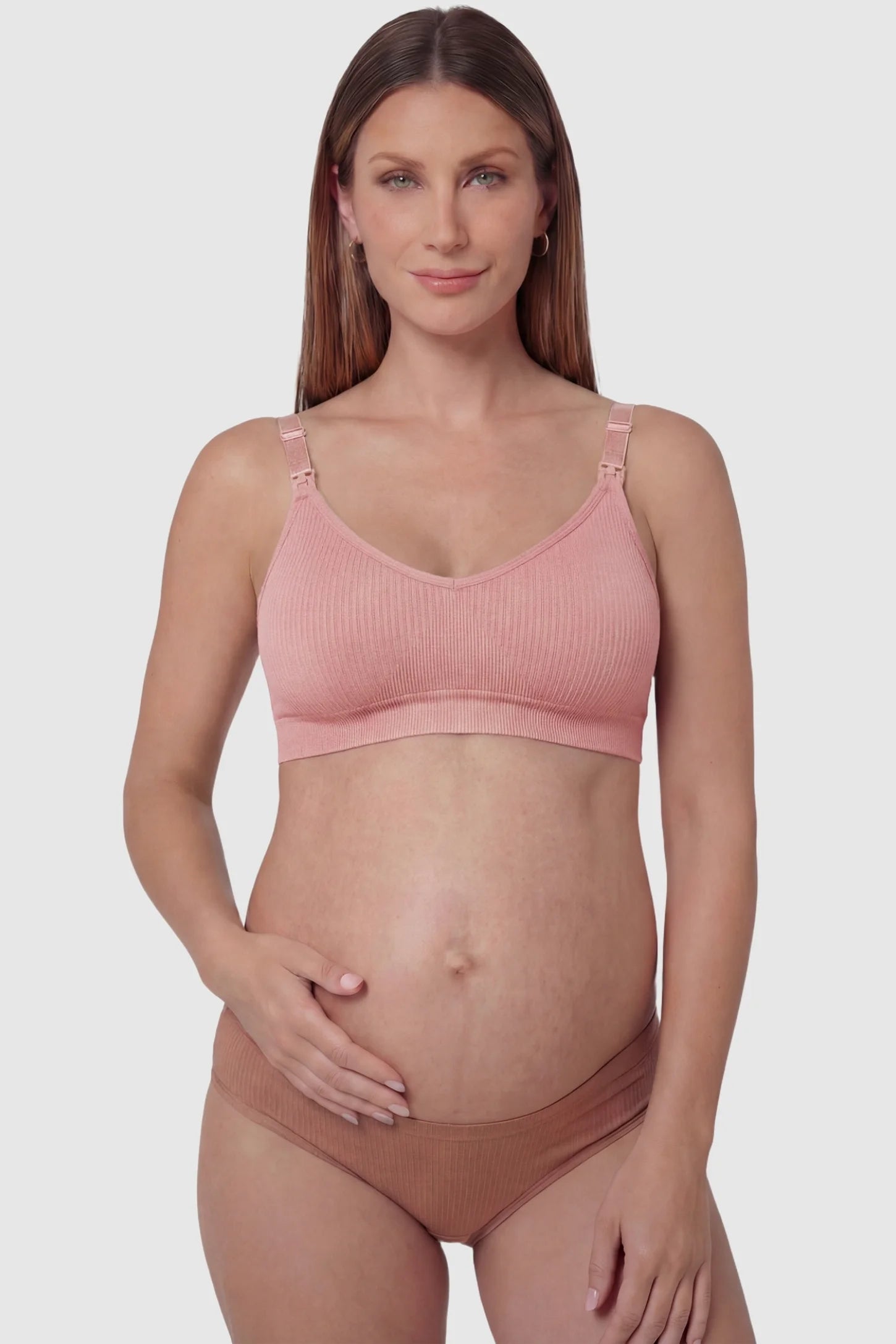 Ribbed wireless adjustable strap nursing bra in bean paste with front clasp, front view on pregnant model
