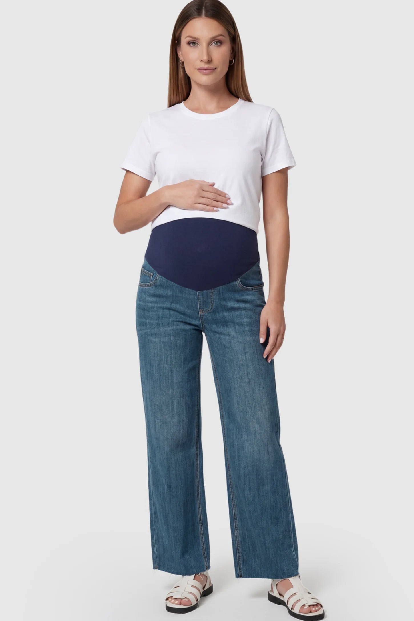 Full Panel Wide Leg Maternity Jeans in Dark Blue featuring a seamless tummy-support band on a pregnant model facing front.