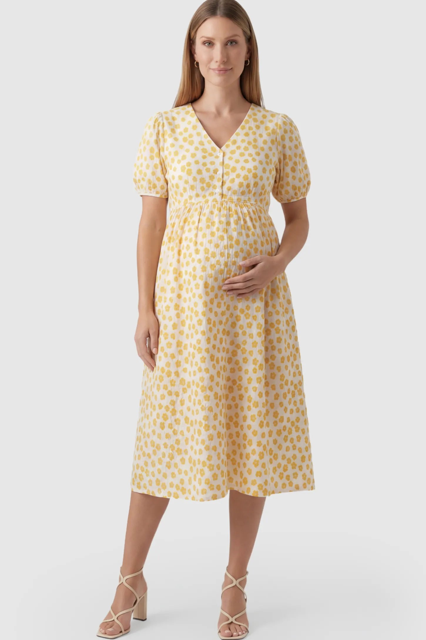 Floral Print V-Neck Maternity Nursing Dress in Yellow featuring functional button-front details on a pregnant model.
