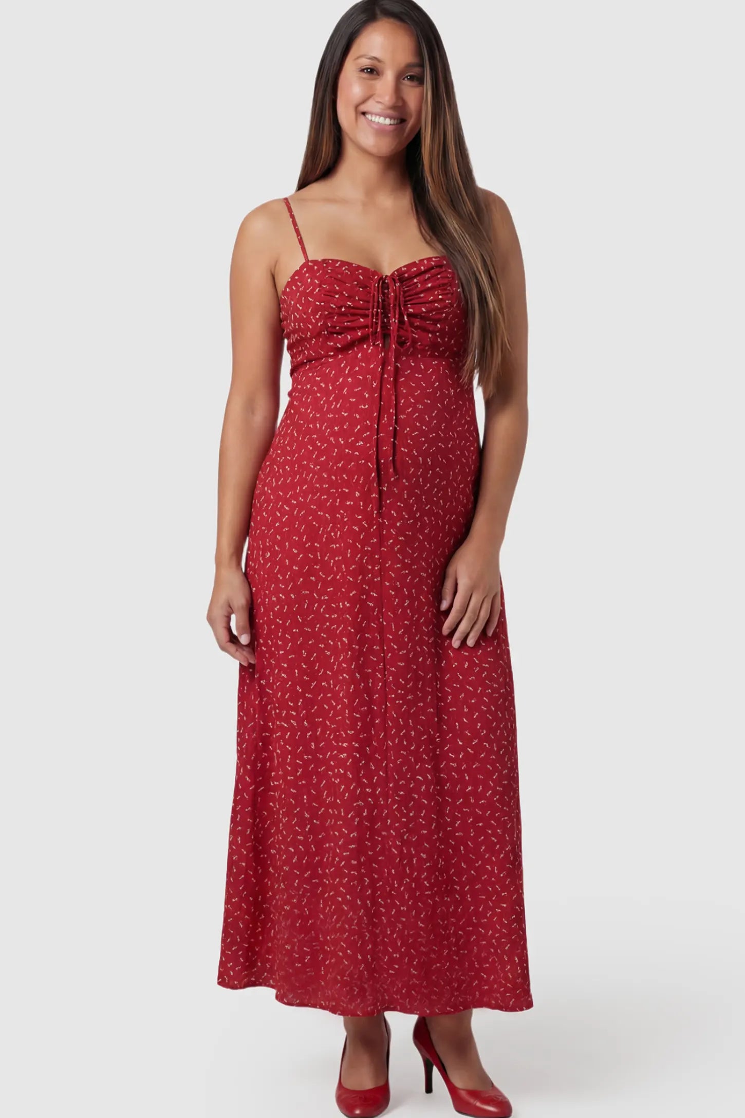 Floral Sweetheart Neck Pleated Midi Maternity Dress in Red Ditsy Floral featuring a delicate chiffon drape on a pregnant model.