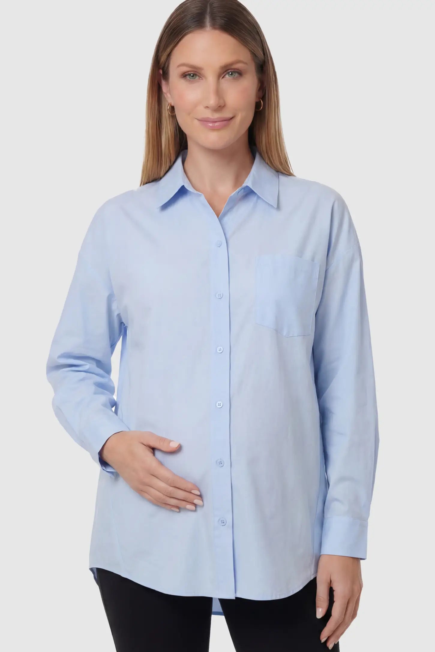 Button Down Collared Maternity Shirt in Light Blue featuring long sleeves and a crisp cotton finish on a pregnant model.