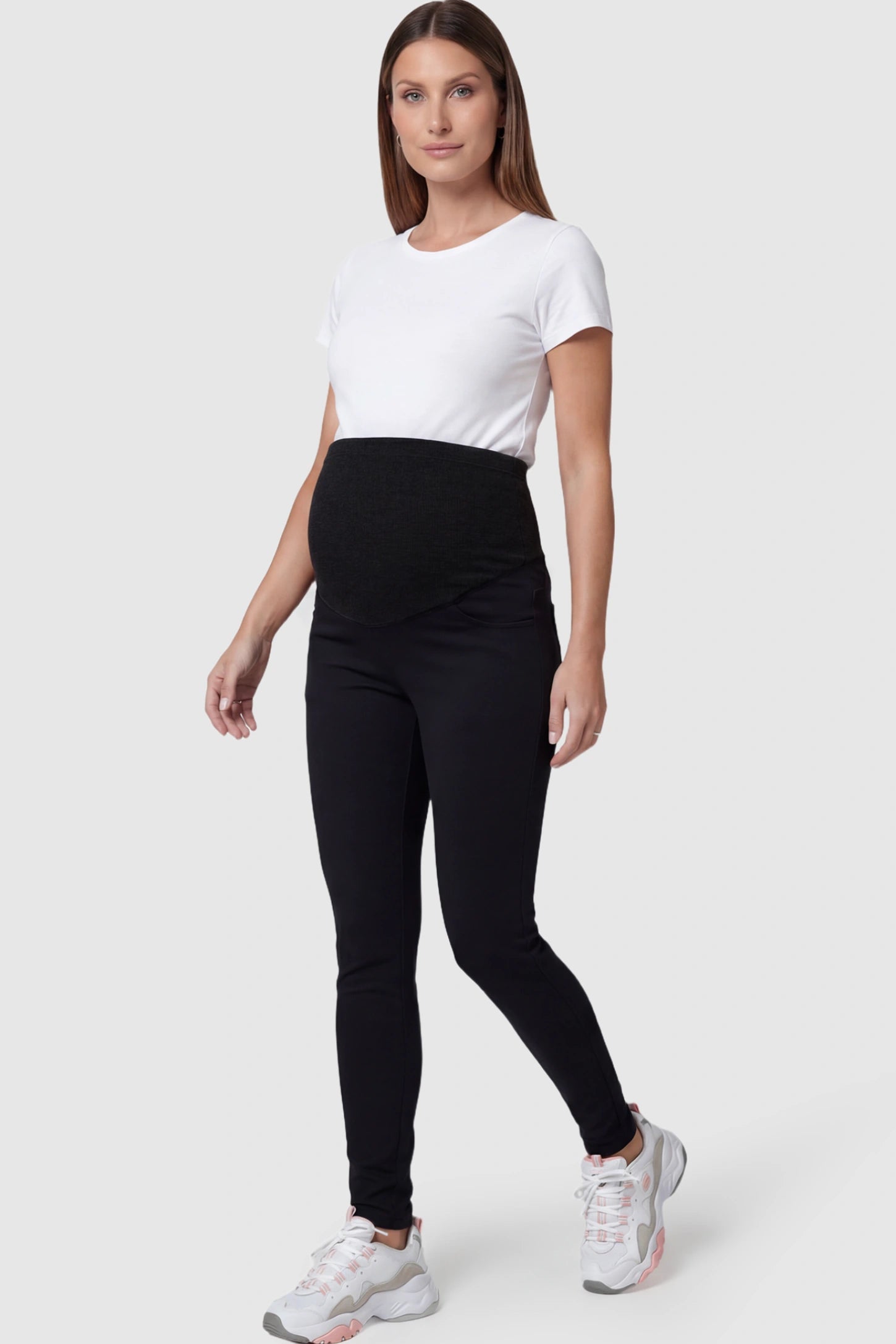 Full Panel Skinny Maternity Pants in black featuring high stretch viscose and cotton blend on a pregnant model.