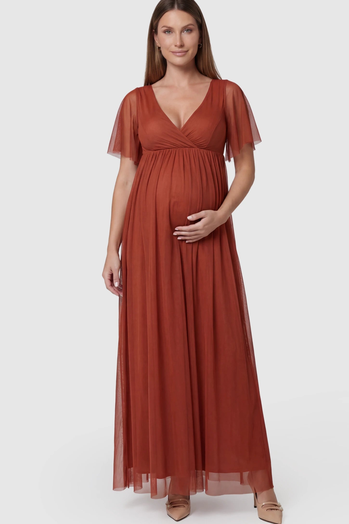 Chiffon Flutter Sleeve V-Neck Maternity Maxi Dress in Rust featuring a mesh overlay on a pregnant model.