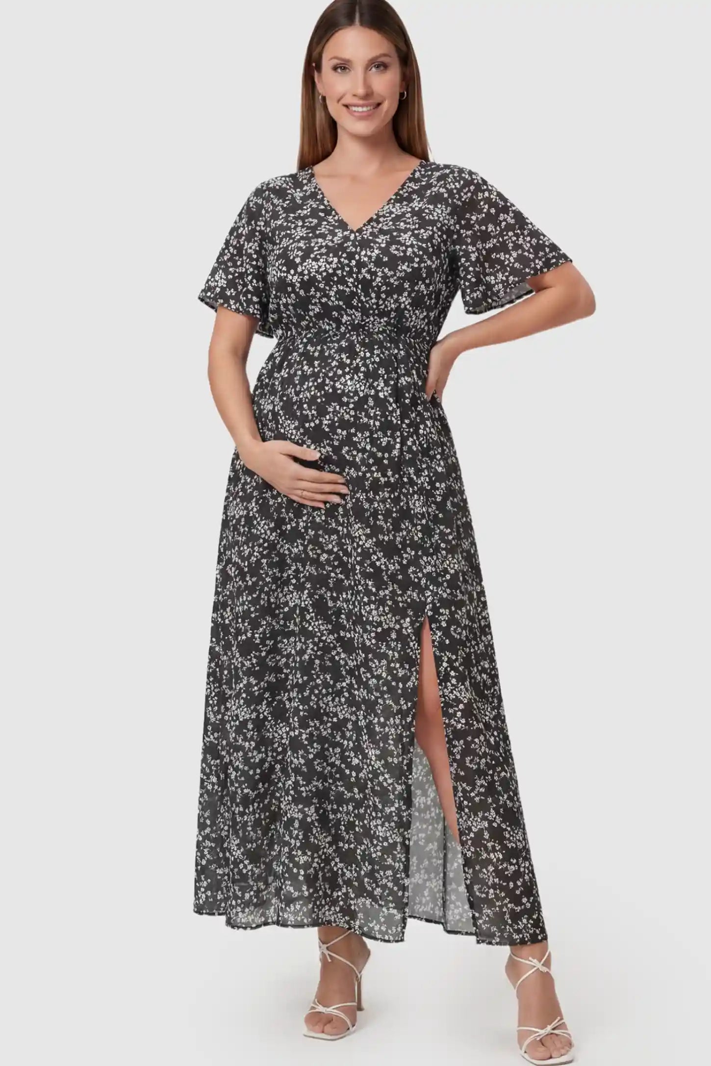 Floral V-Neck Side-Slit Maternity Maxi Dress in black on a pregnant model.