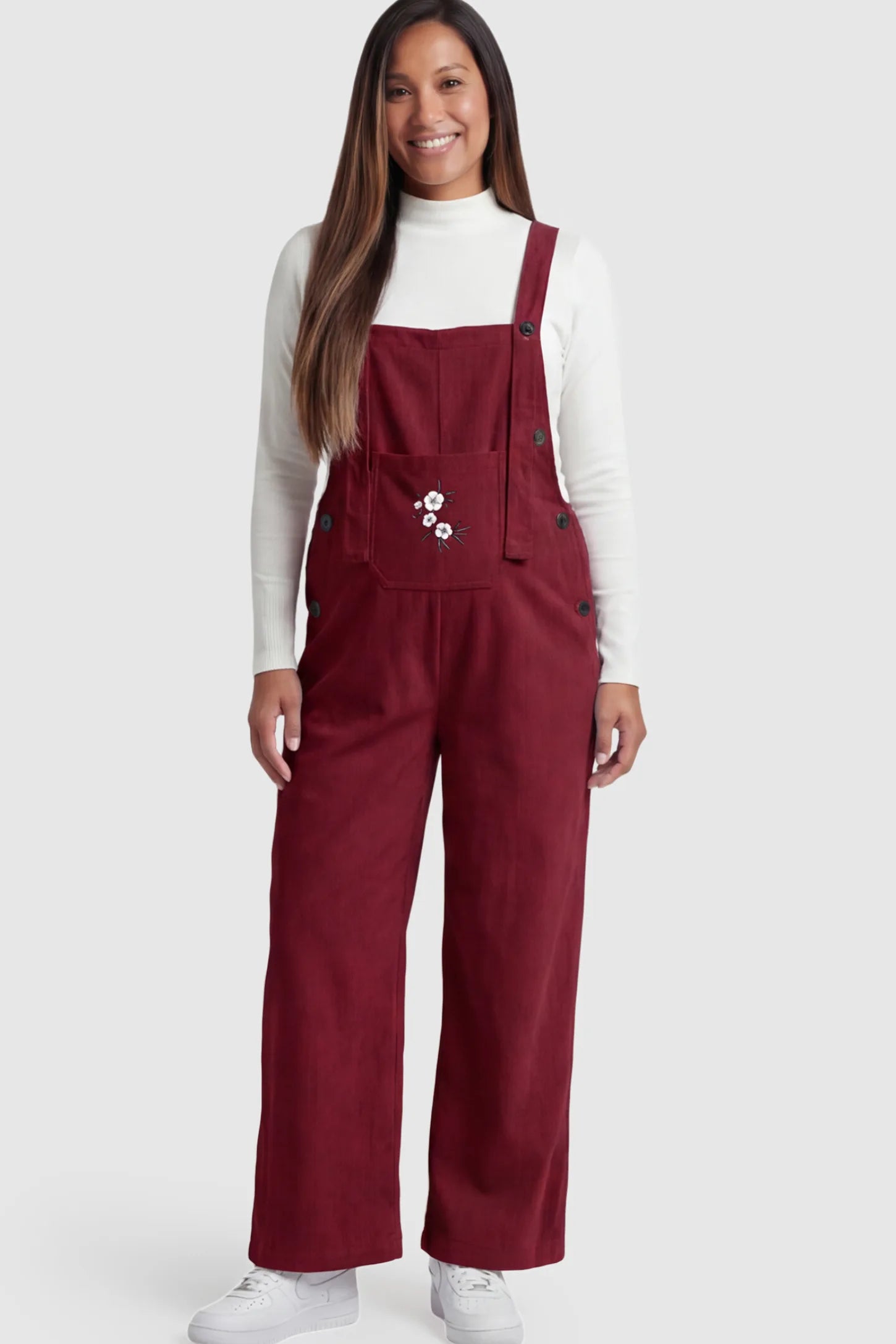 Floral Embroidered Wide-Leg Maternity Overalls in Red with adjustable straps on a pregnant model.
