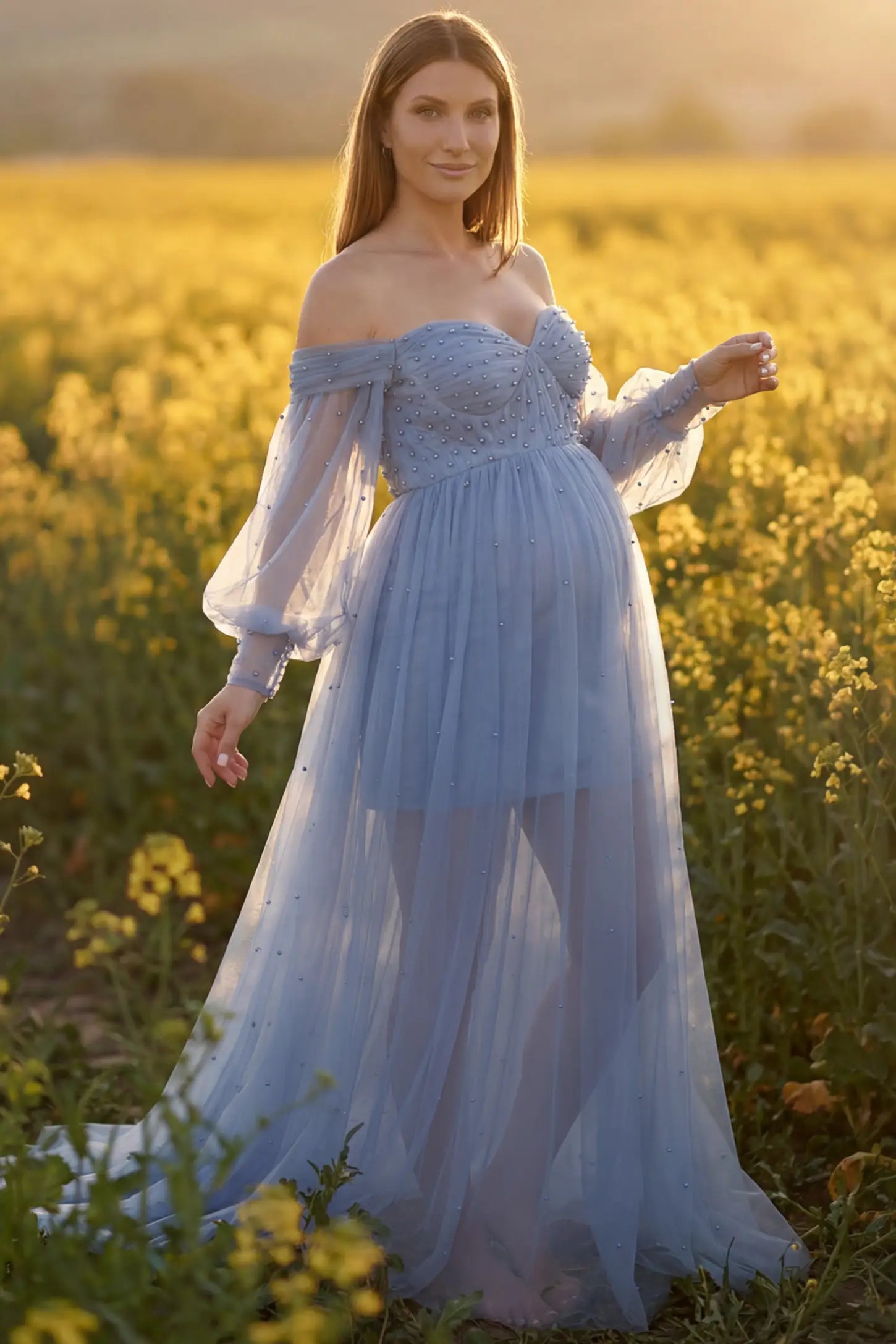 Off-Shoulder Empire Waist Maternity Gown in blue featuring a sweetheart neckline and flowy A-line silhouette on a pregnant model, front view.