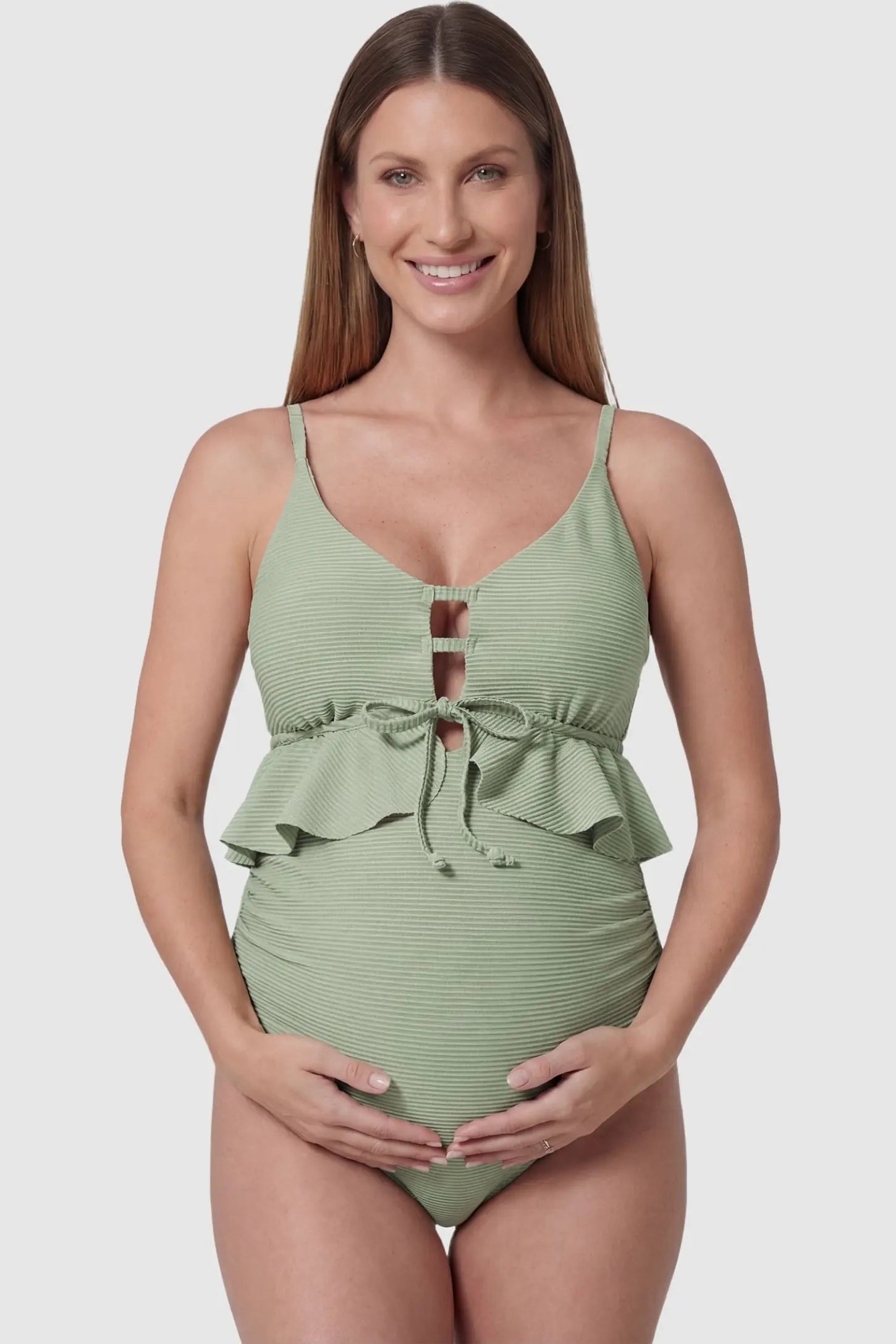 Ruffle Trim Halter Neck Maternity Swimsuit in Mint Green featuring a tie-front detail on a front-facing pregnant model.