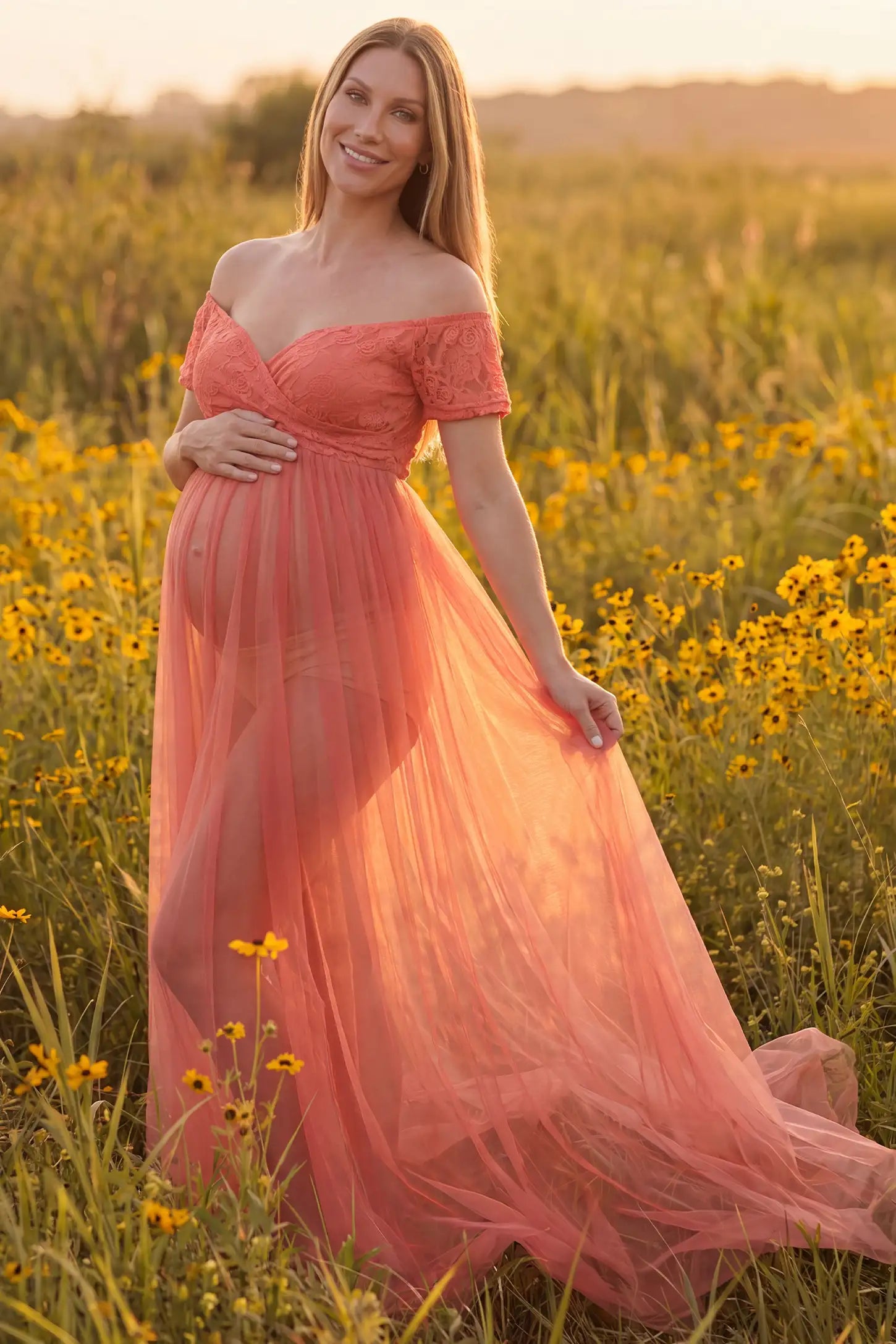 Lace Sheer Overlay Off Shoulder Maternity Photoshoot Gown in Rose featuring sweetheart neckline and flowing sheer skirt on a front view pregnant model.