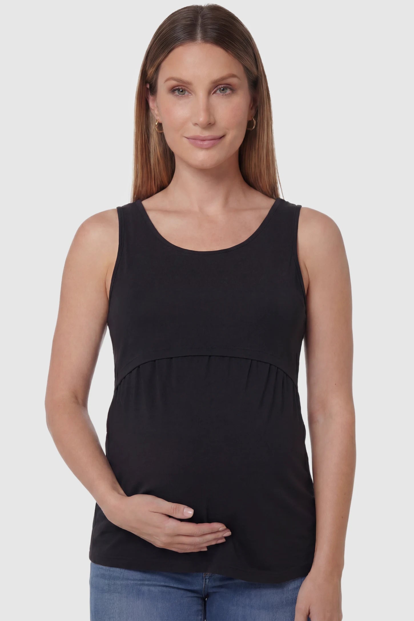 Basic Maternity & Nursing Tank Top in black featuring a scoop neck and smooth, body-hugging fit on a pregnant model, front view.