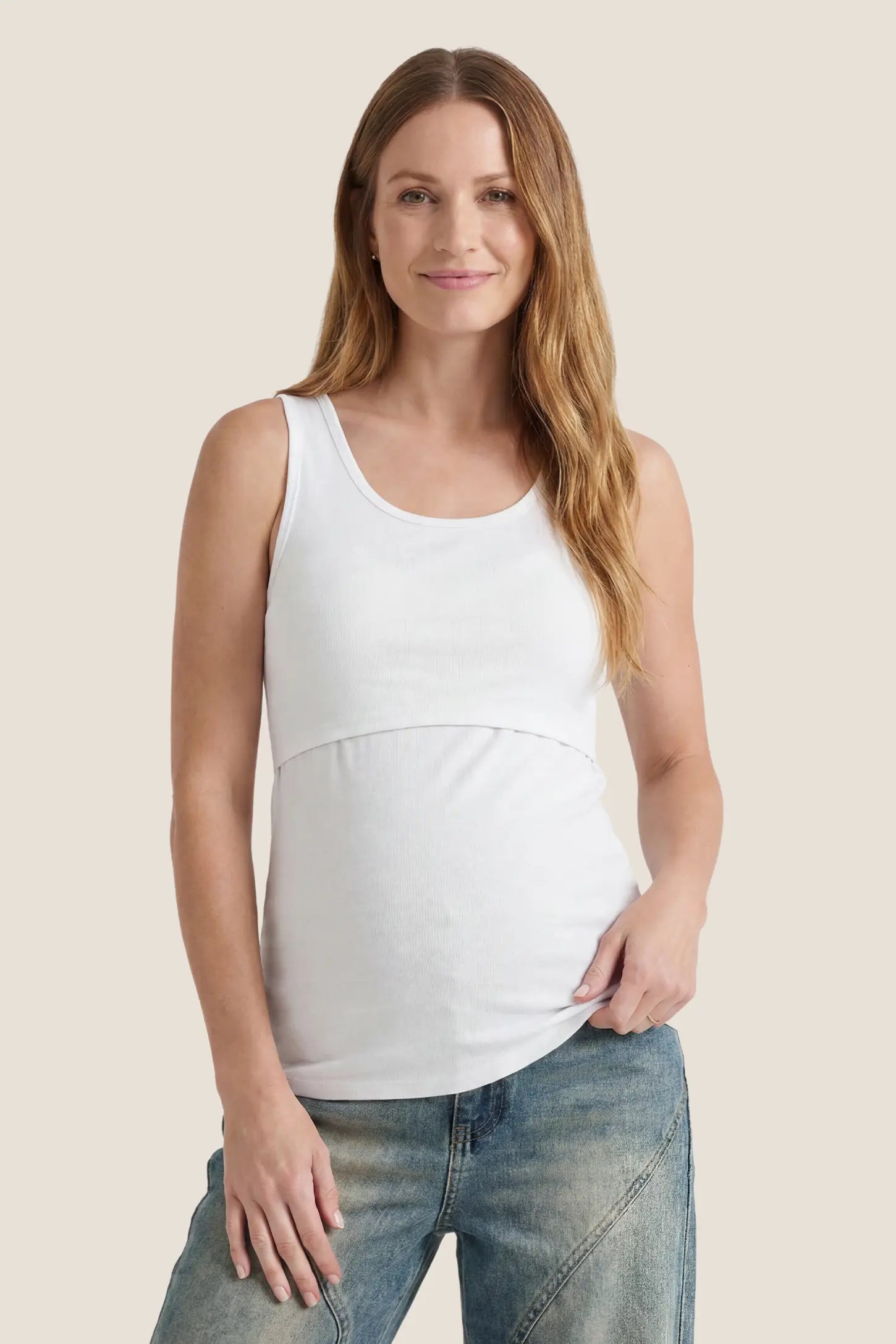 Basic Maternity & Nursing Tank Top in white featuring a scoop neck and smooth, body-hugging fit on a pregnant model front view.