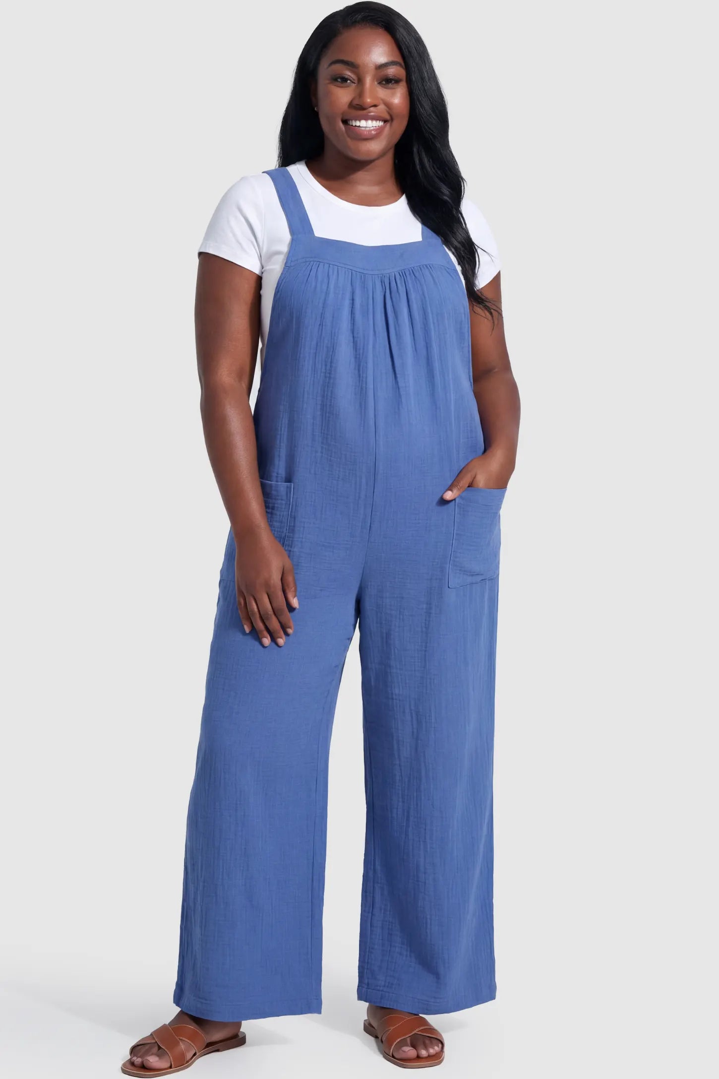 Square neck tie-back wide leg maternity overalls in royal blue with square neckline and front pockets, front view on pregnant model