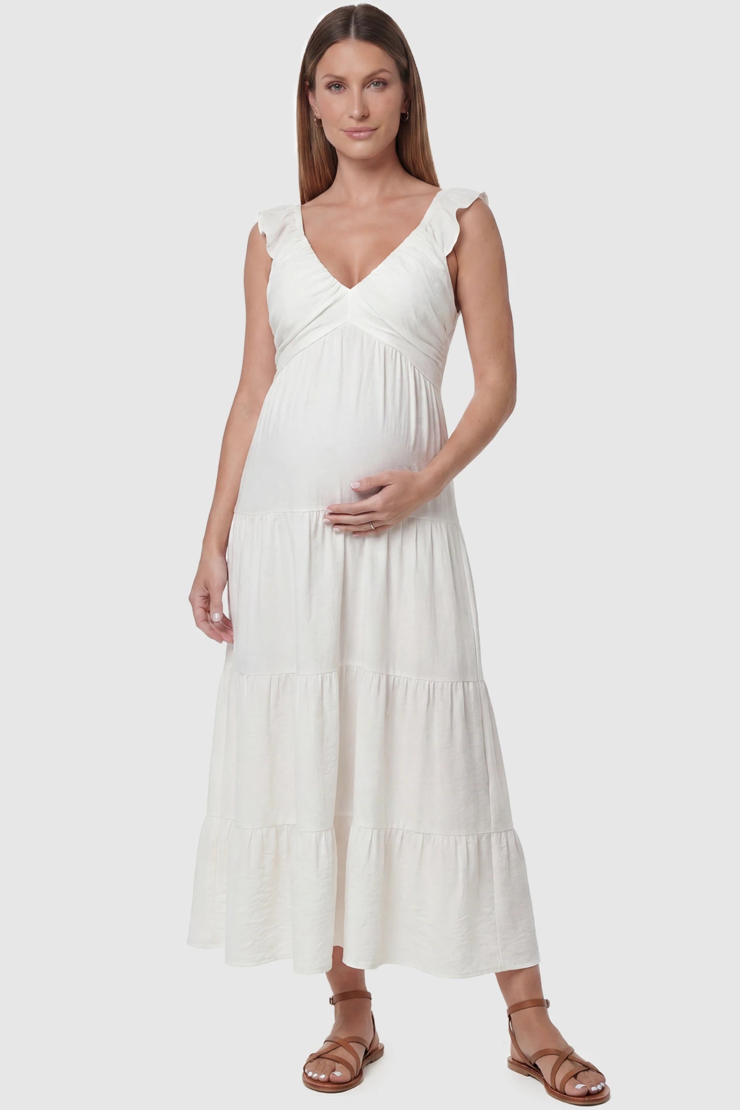 Ruffled sleeve V-neck A-line maternity midi dress in off-white with V-neckline and ruffled sleeves, front view on pregnant model