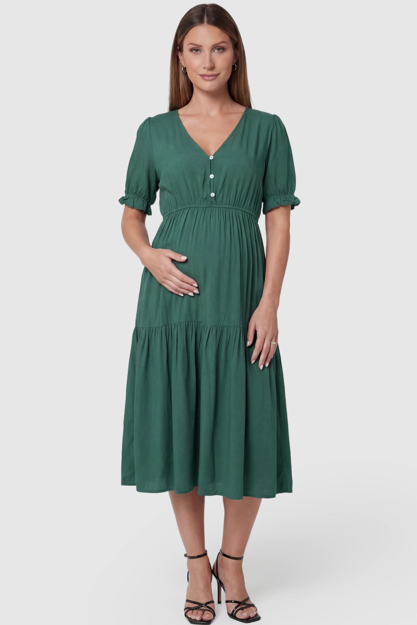 Tiered Hem A-Line Maternity Midi Dress in army green featuring empire waist, elbow-length puff sleeves, V-neckline, and flowy skirt on pregnant model. front view