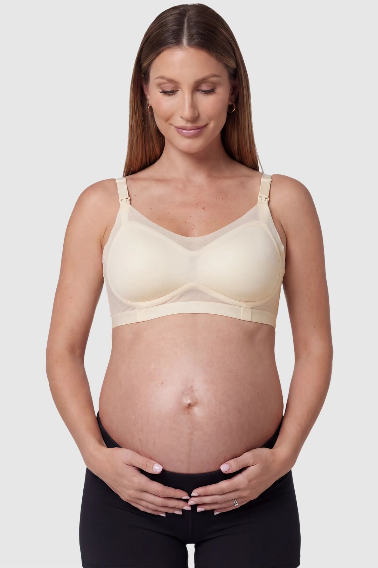 Top-Open One-Handed Ice Silk Nursing Bra in Skin Tone featuring a wireless, supportive fit on a pregnant model, front view.