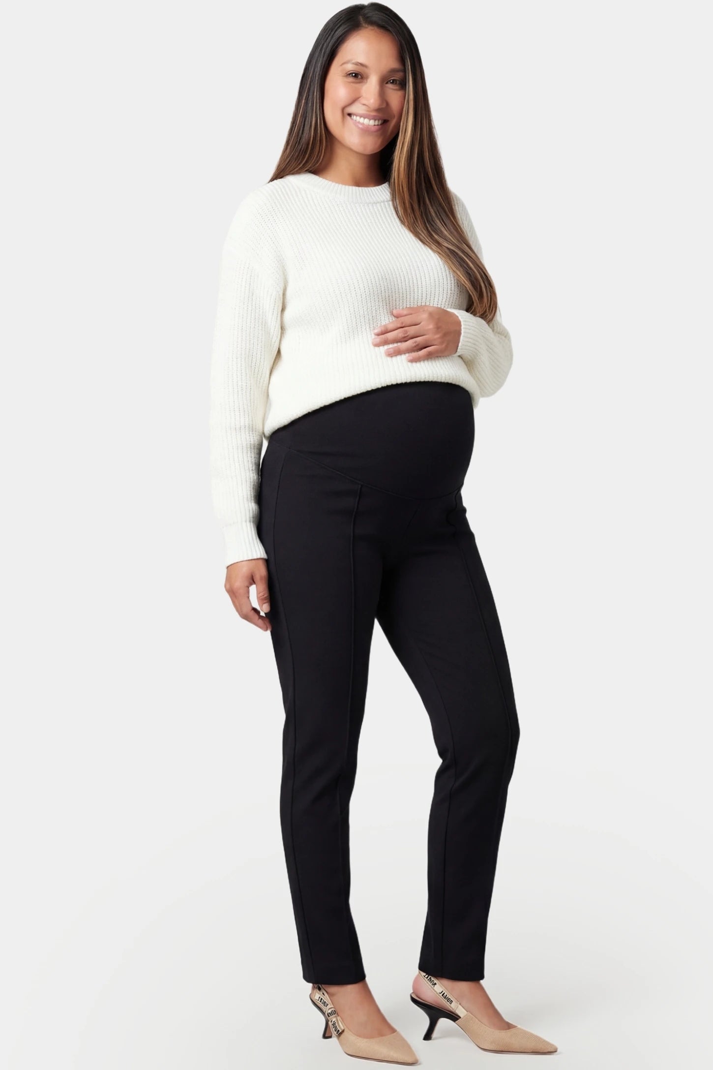 High-waist slim-fit cigarette maternity pants in black with supportive belly band, full body on pregnant model