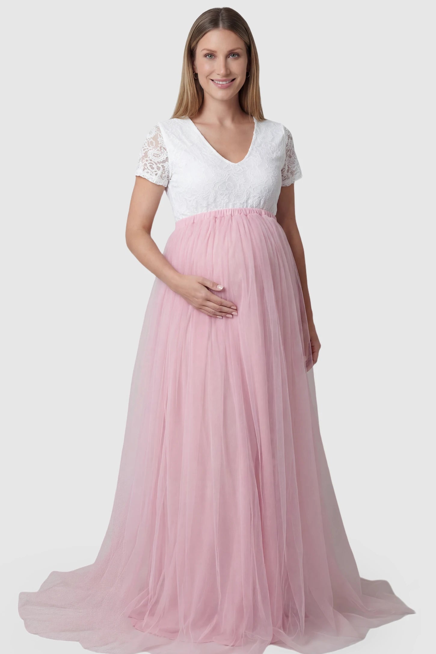 Lace & Tulle Short Sleeve Maternity Gown in pink featuring V-neck lace bodice, empire waist, and flowing tulle train on pregnant model.