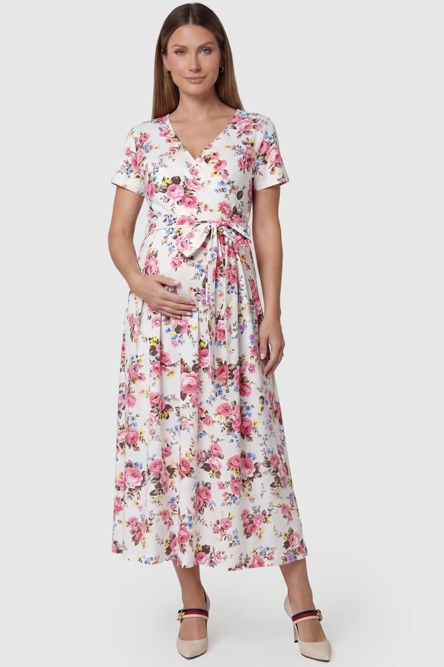 Discreet Nursing Opening Floral Tie-Waist Maternity & Nursing Maxi Dress in Pink Floral featuring a faux-wrap neckline on a pregnant model.