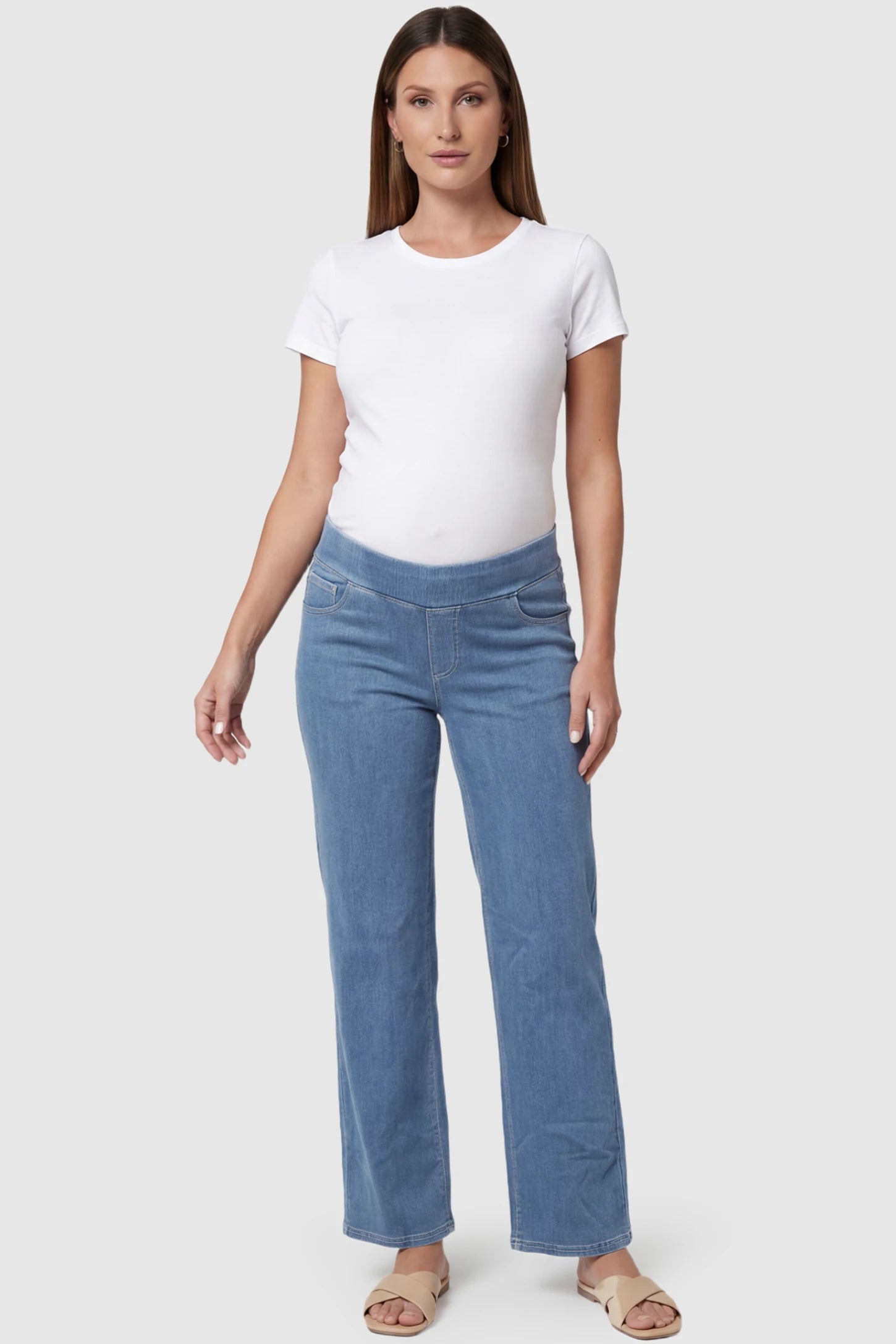 High-Rise Wide Leg Maternity Jeans in light blue featuring over-the-belly support and wide-leg silhouette on a pregnant model, front view.