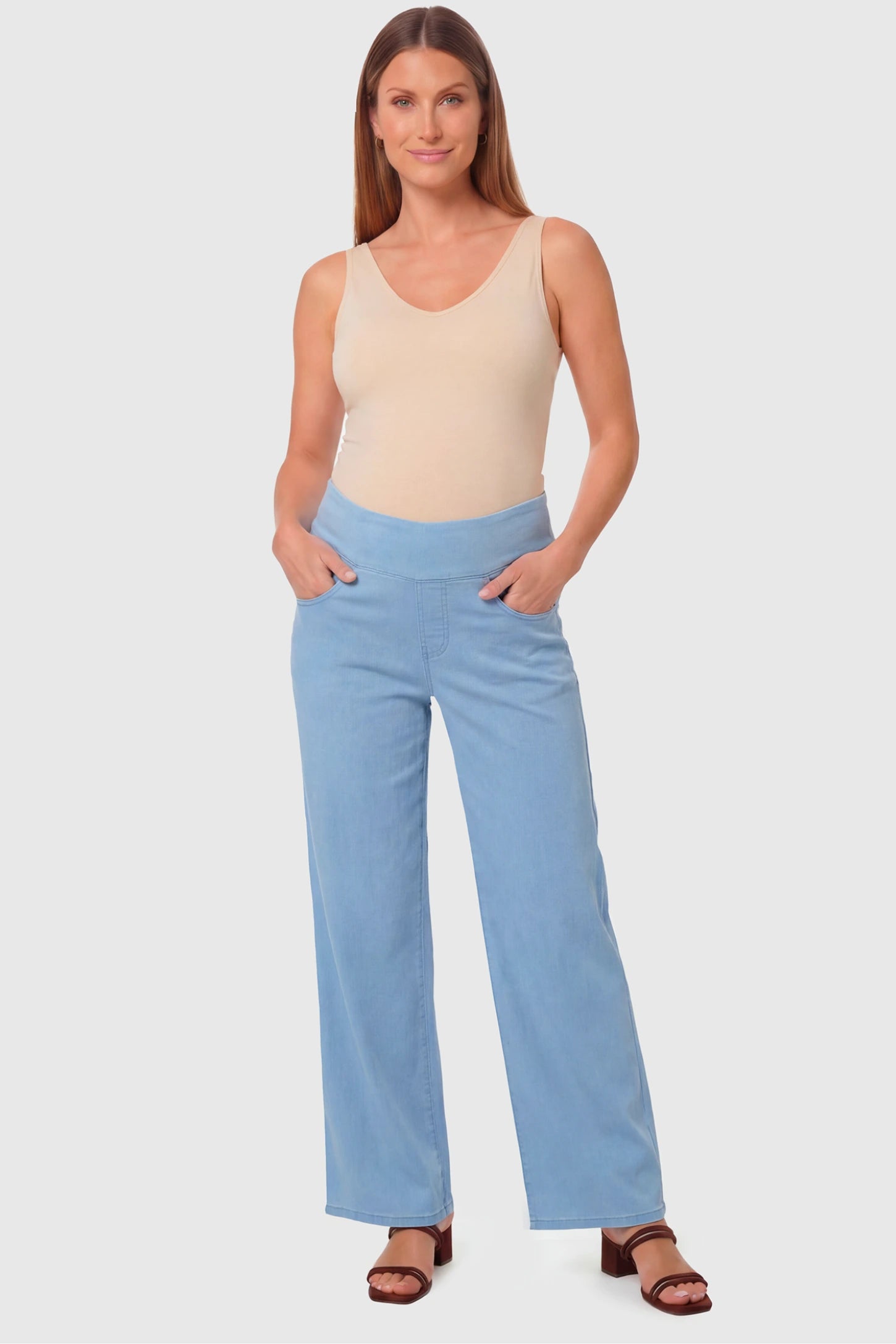 High-Rise Wide Leg Maternity Jeans in light blue featuring over-the-belly support and wide-leg silhouette on a pregnant model.