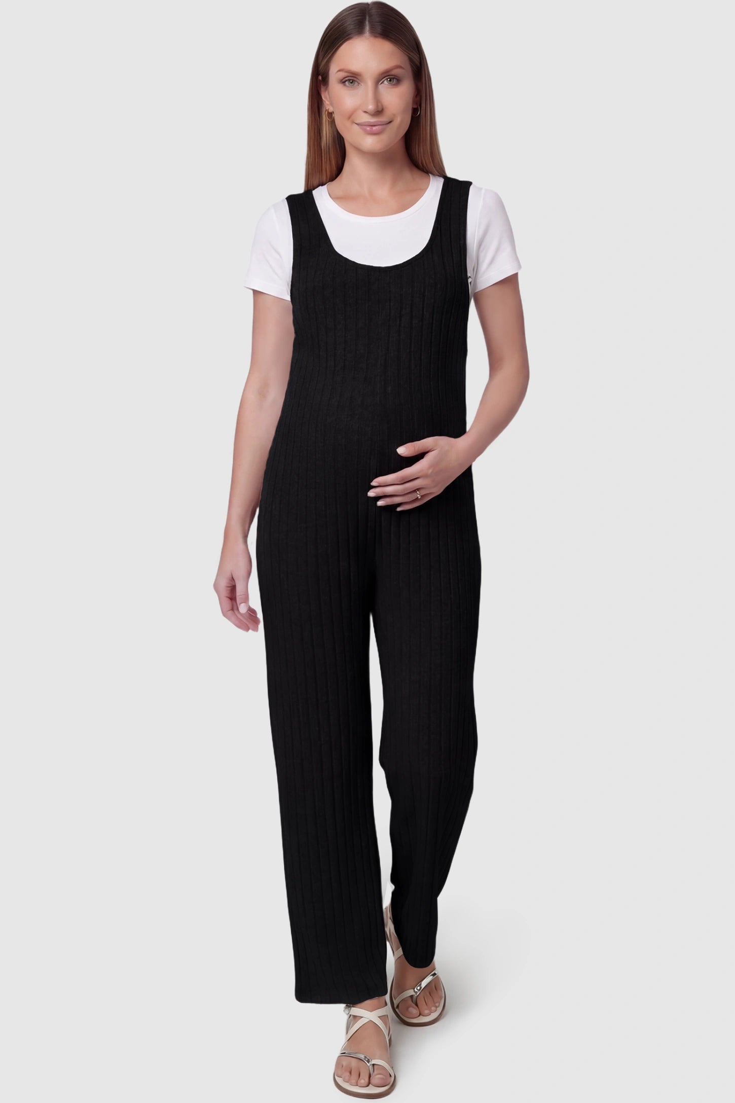 Ribbed sleeveless wide-leg maternity jumpsuit in black with sleeveless ribbed design, front view on pregnant model