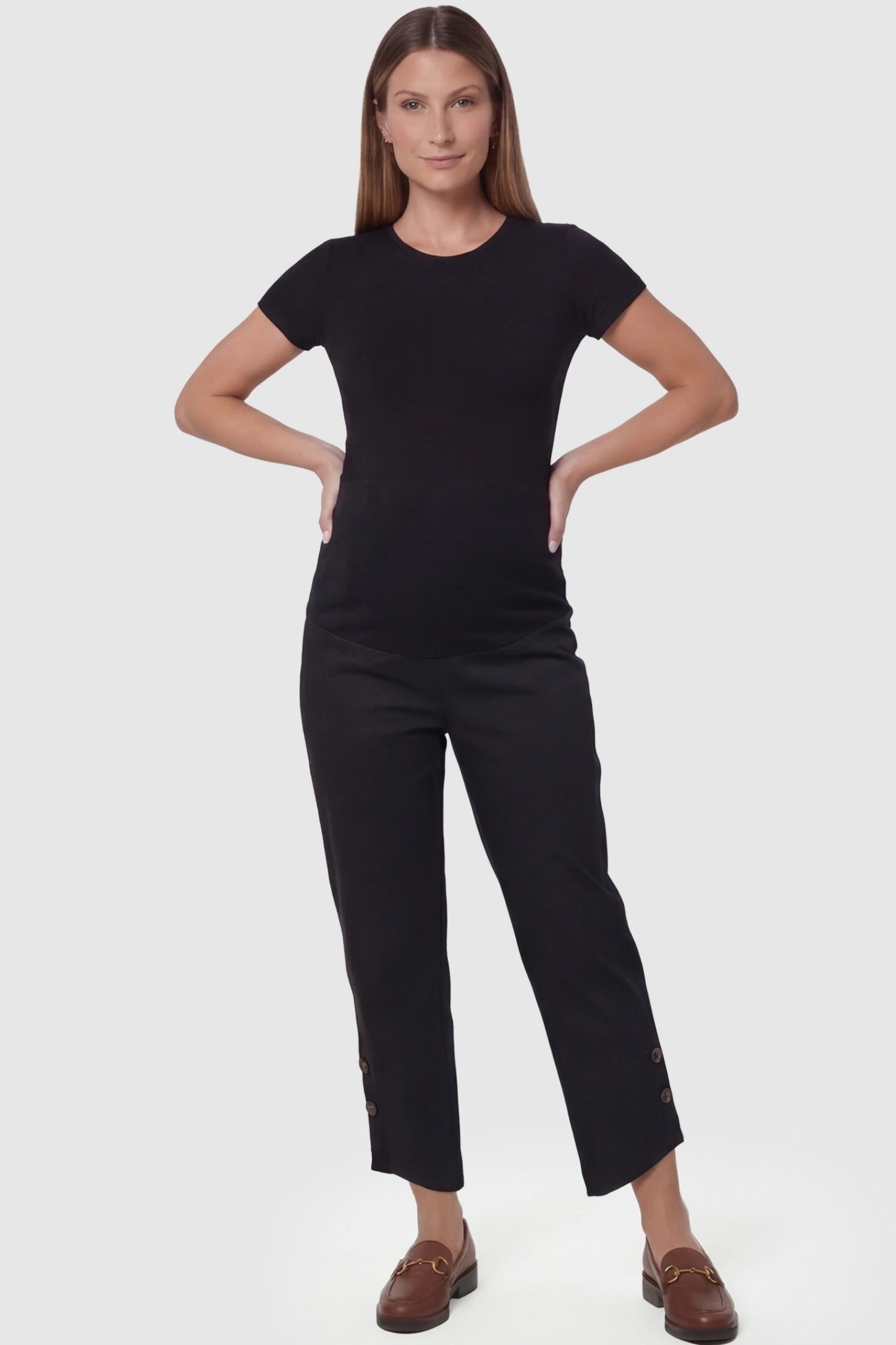 Black Woolen Blend Adjustable Cropped Wide Leg Maternity Slacks featuring button-cuff detailing on a pregnant model in full body shot.
