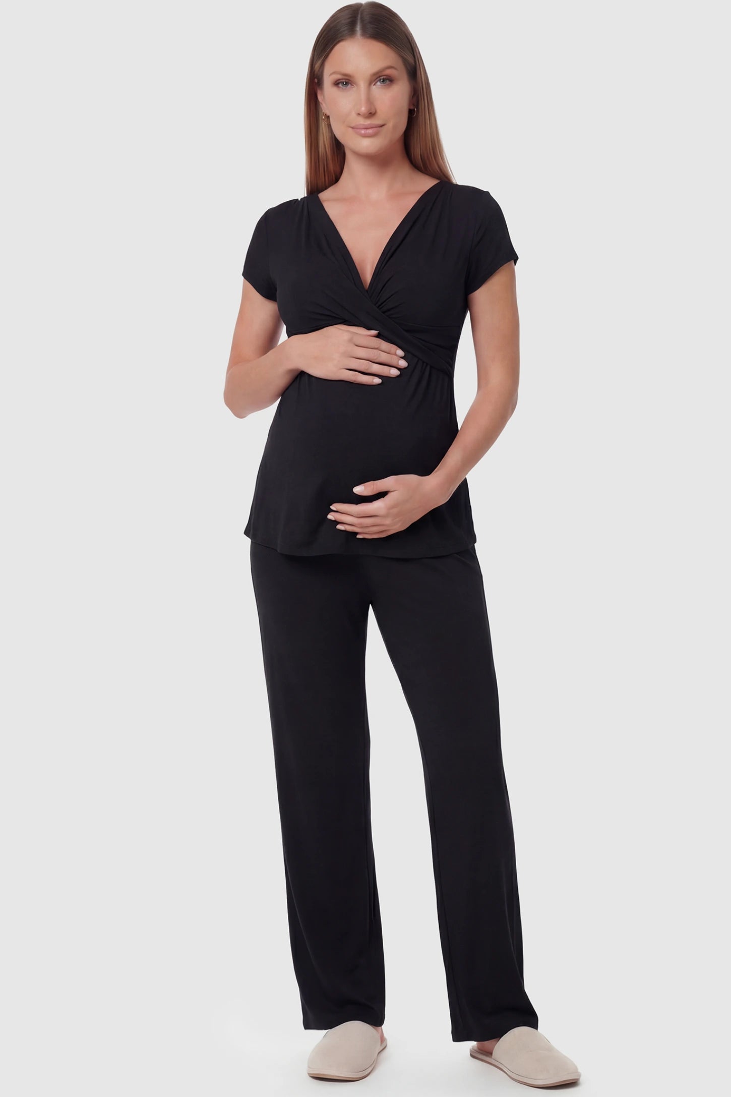 Wrap-Front Wide-Leg Maternity & Nursing Pajama Set in black featuring V-neck crossover top and flowy wide-leg pants on pregnant model.