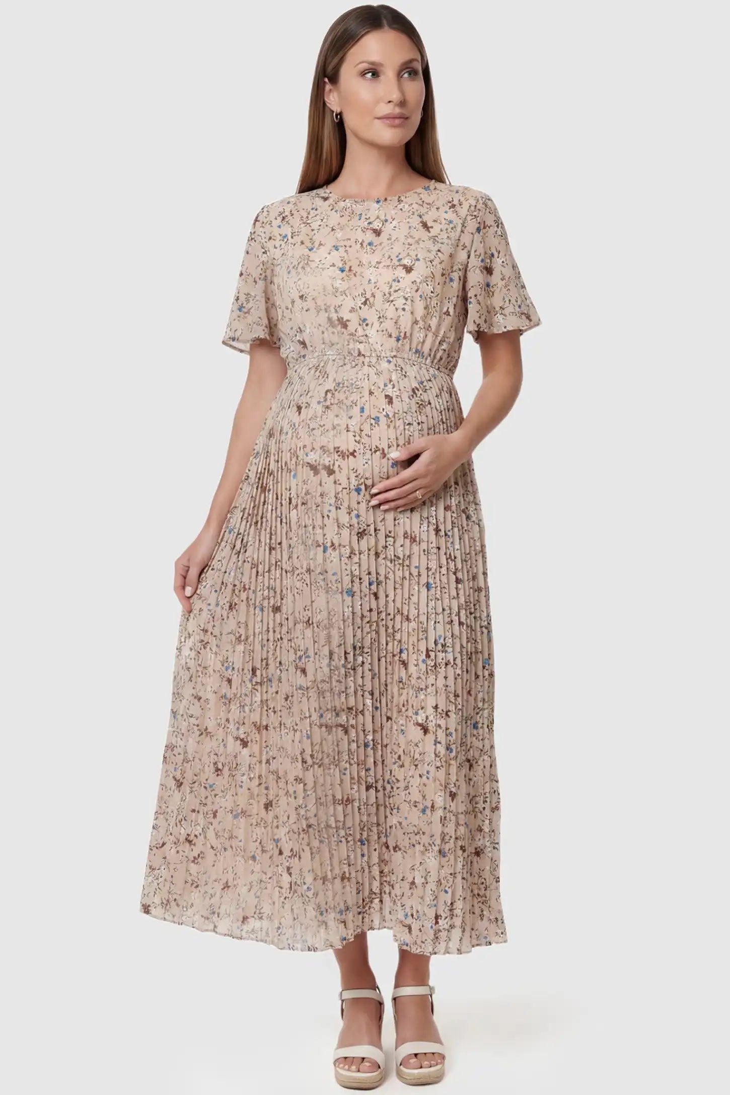 Floral Print Round Neck Pleated Maternity Midi Dress in Beige Floral Print featuring a pleated A-line skirt on a pregnant model, front view.