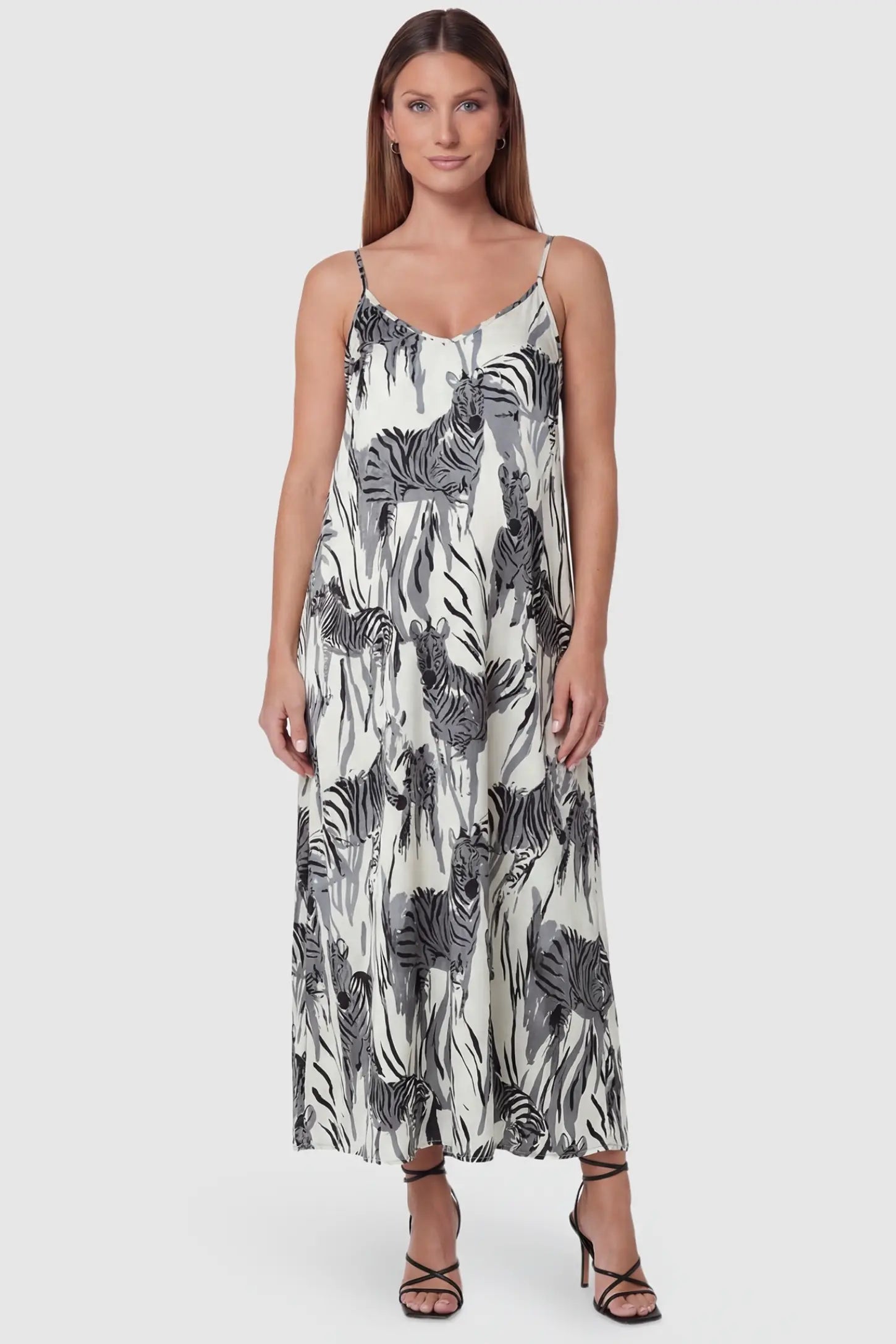 Zebra Print V-Neck Sleeveless Maxi Maternity Dress in Gray featuring a flowy A-line silhouette on a front view pregnant model.