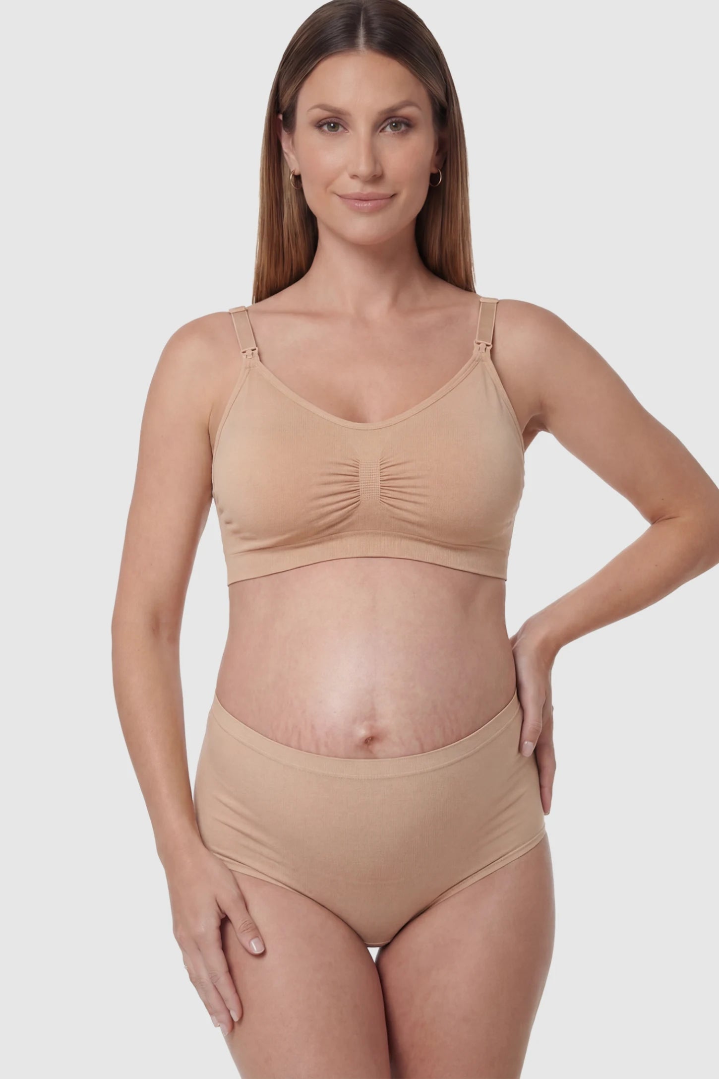 Seamless Ruched Wireless Nursing Bra in Lotus Root Pink with one-handed clips and adaptive stretch on a pregnant model.