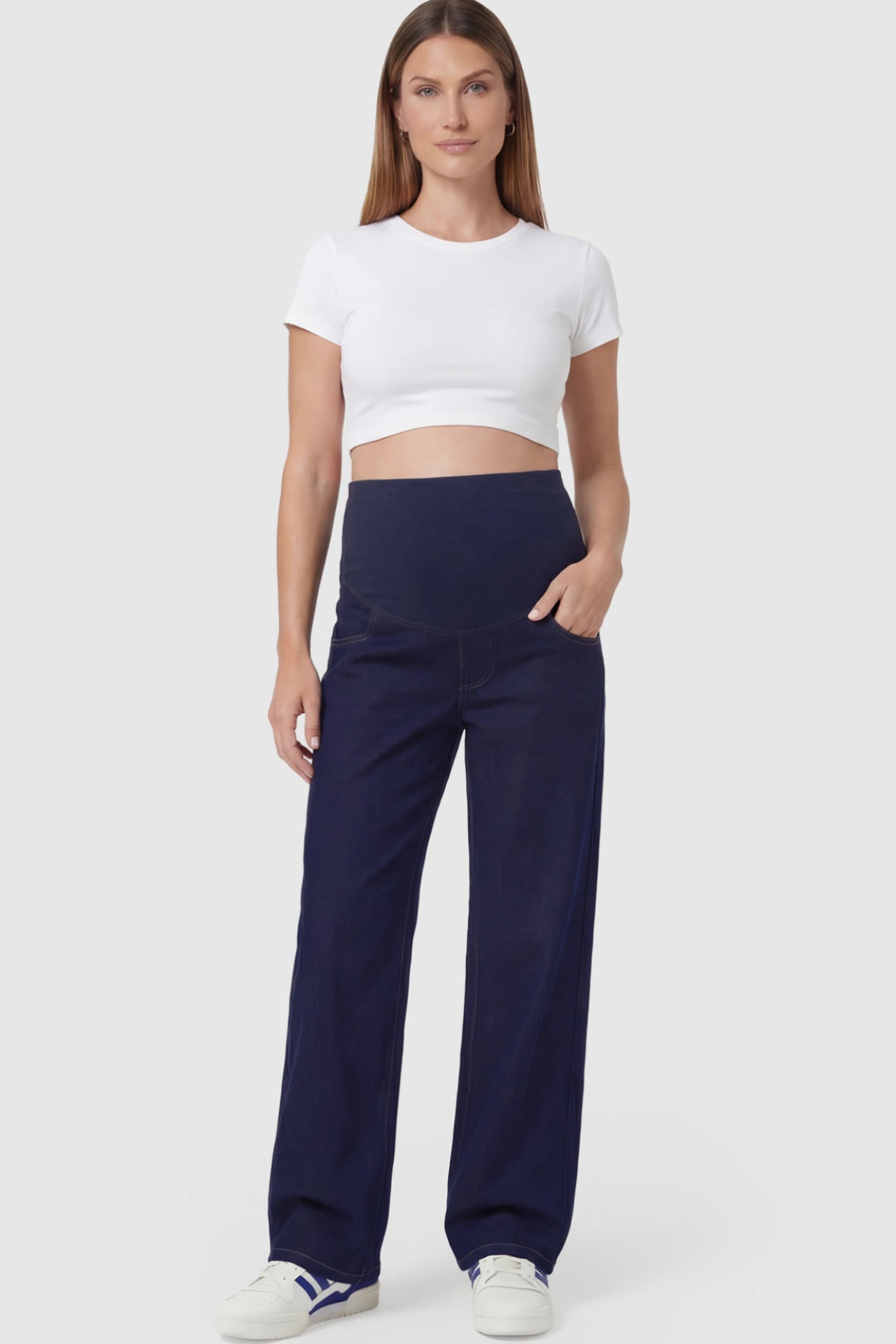 Full Panel Wide-Leg Maternity Jeans in Blue featuring a belly panel on a pregnant model.