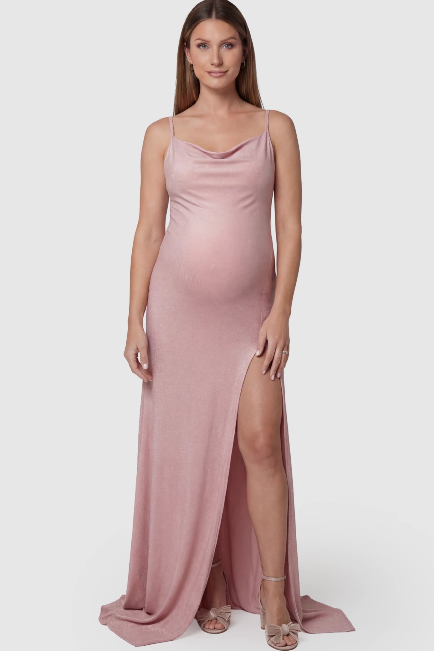 Spaghetti Strap Side Slit Slim Fitting Maternity Maxi Dress in Shimmer Pink featuring a draped neck on a pregnant model.