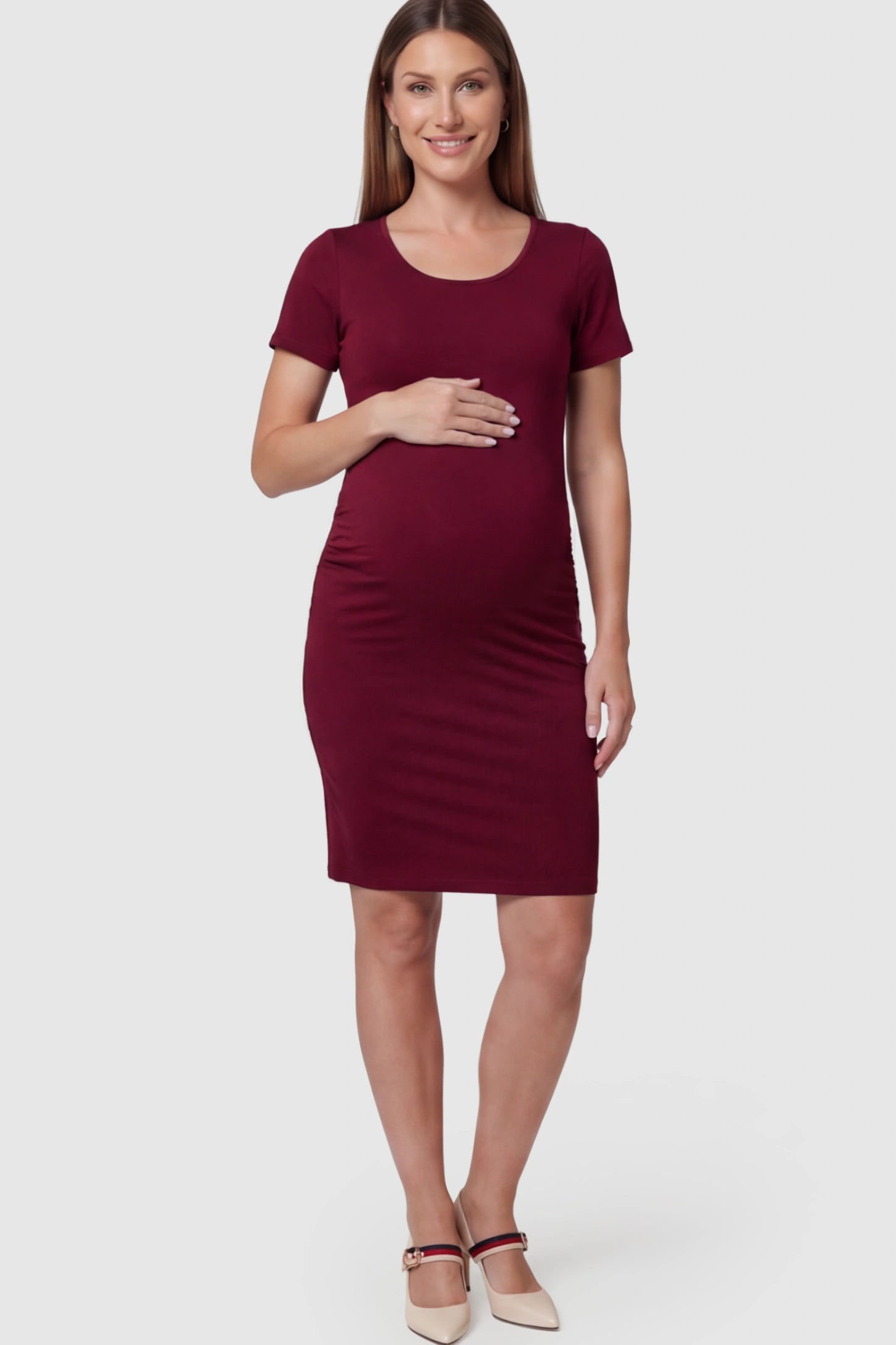 Ruched Side Scoop Neck Maternity Short Dress in Burgundy featuring a form-fitting silhouette on a pregnant model.
