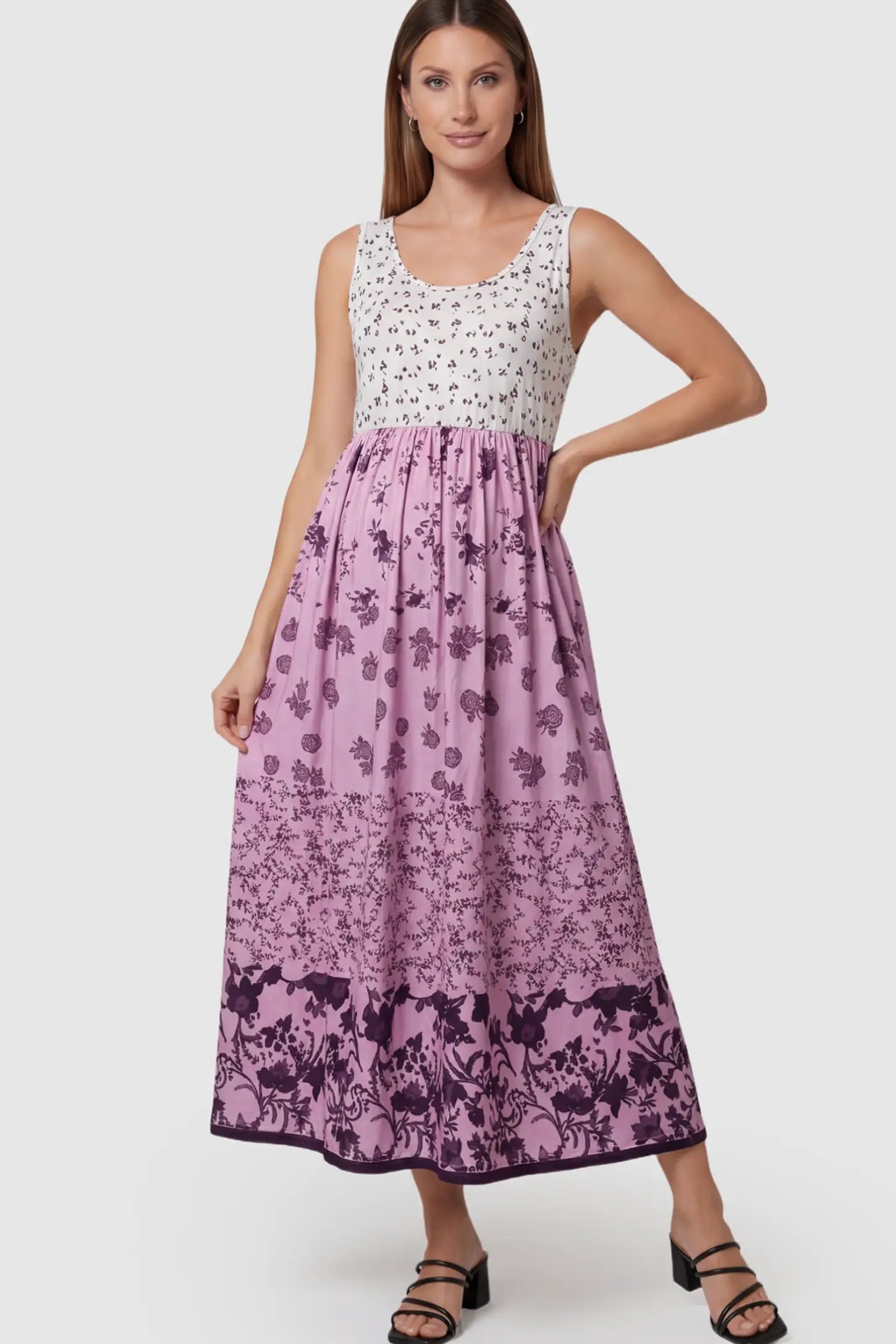 Floral Print Scoop Neck Maternity Midi Dress in pink floral featuring a high empire waist on a pregnant model.