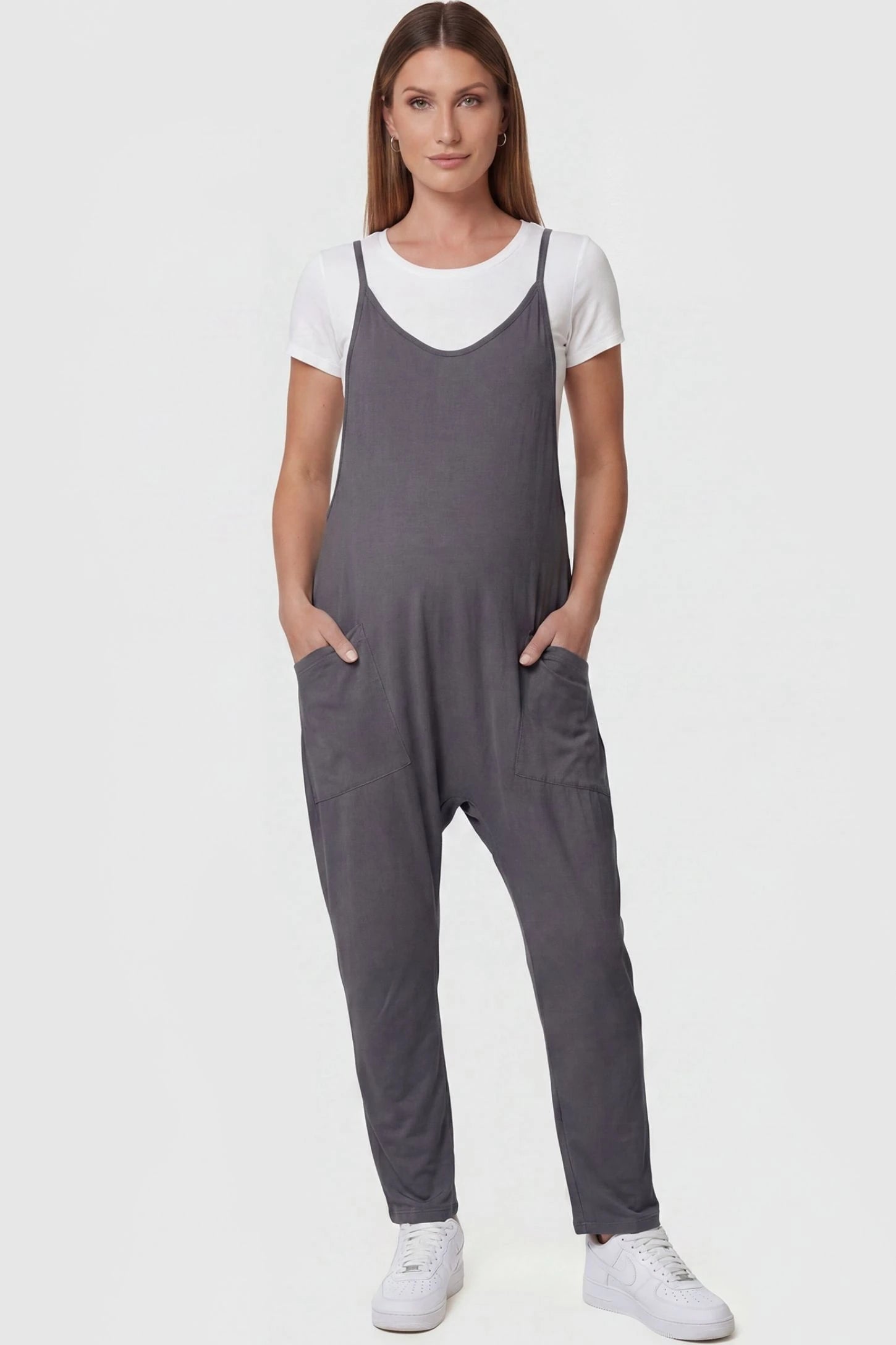 Adjustable Strap Pocketed Maternity Jumpsuit in Dark Gray featuring a relaxed fit on a pregnant model, front view.