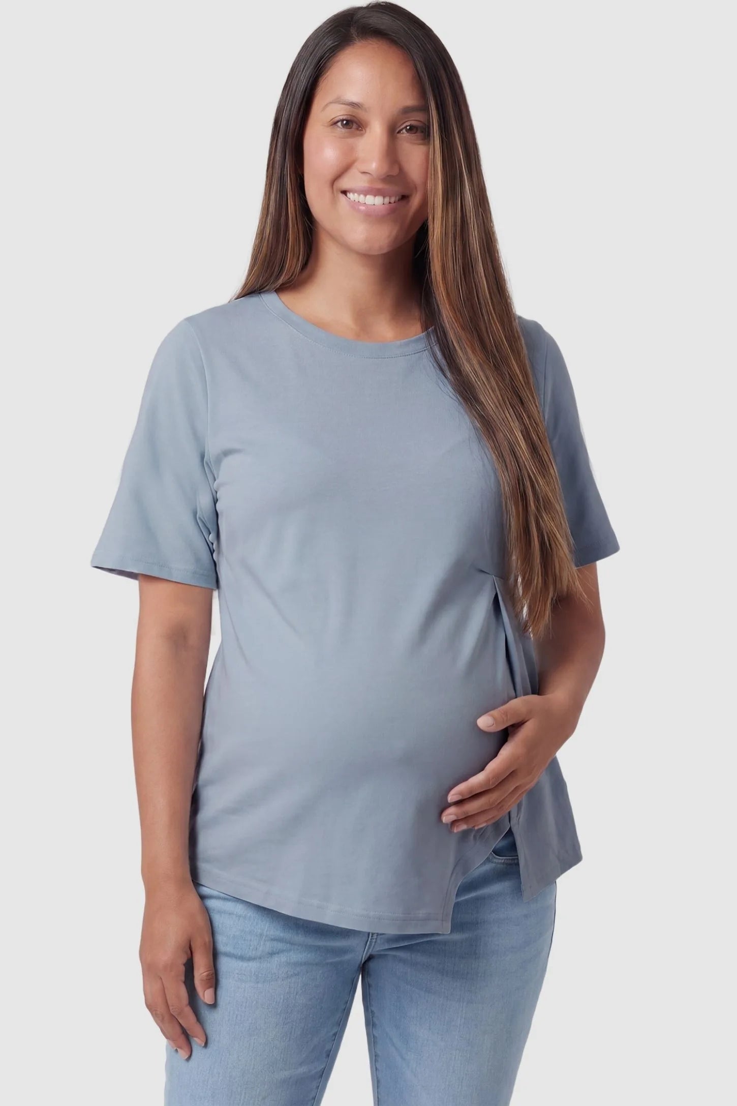 Front view of Asymmetrical Hem Relaxed Short Sleeve Maternity Top in Blue featuring a pleated front on a pregnant model.