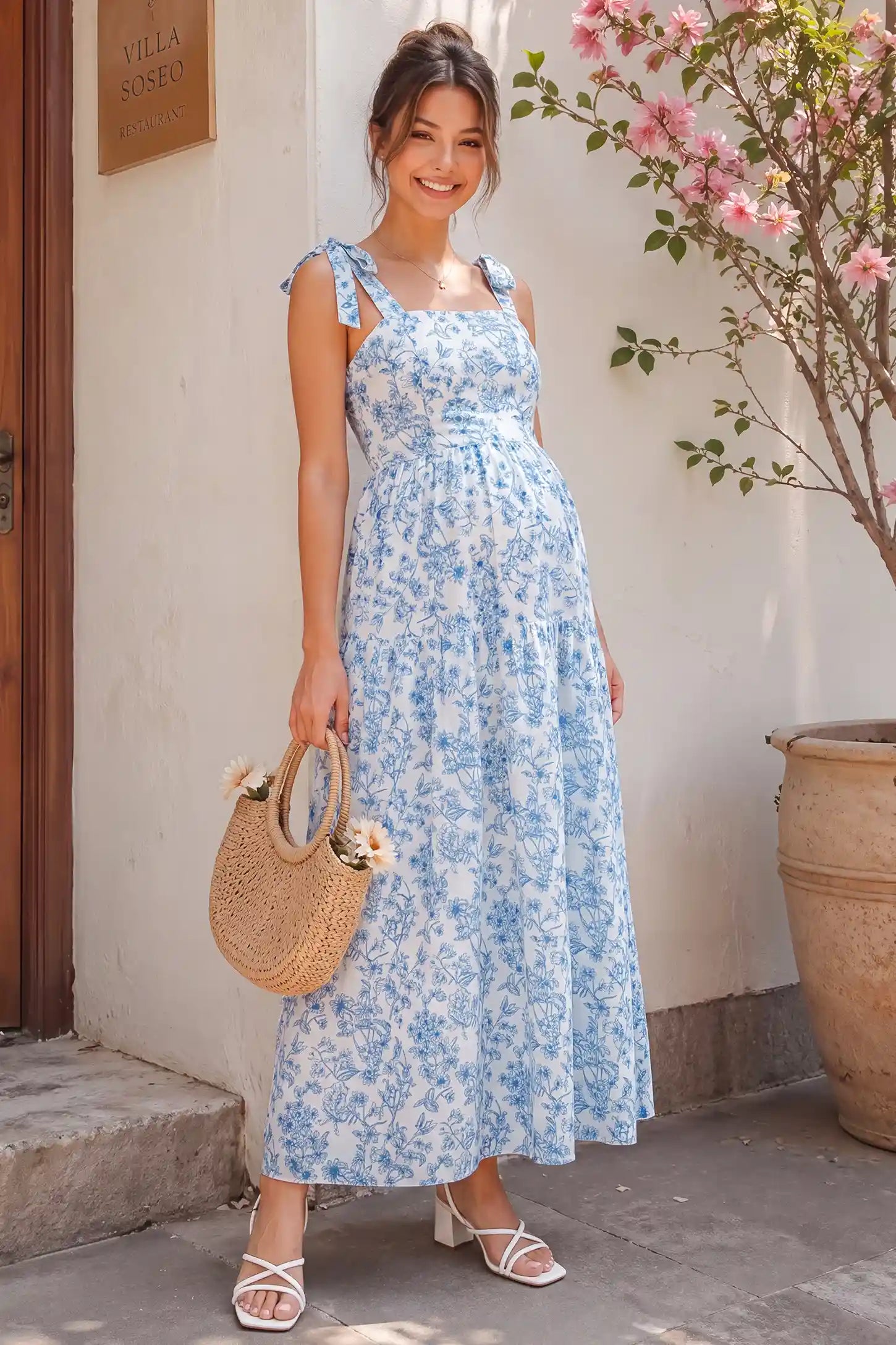 Blue and white floral cami maternity tiered maxi dress on a pregnant model, showcasing the light and airy fabric.